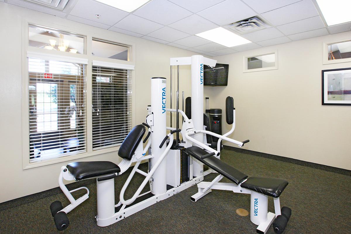 an office with a desk and chair in a room