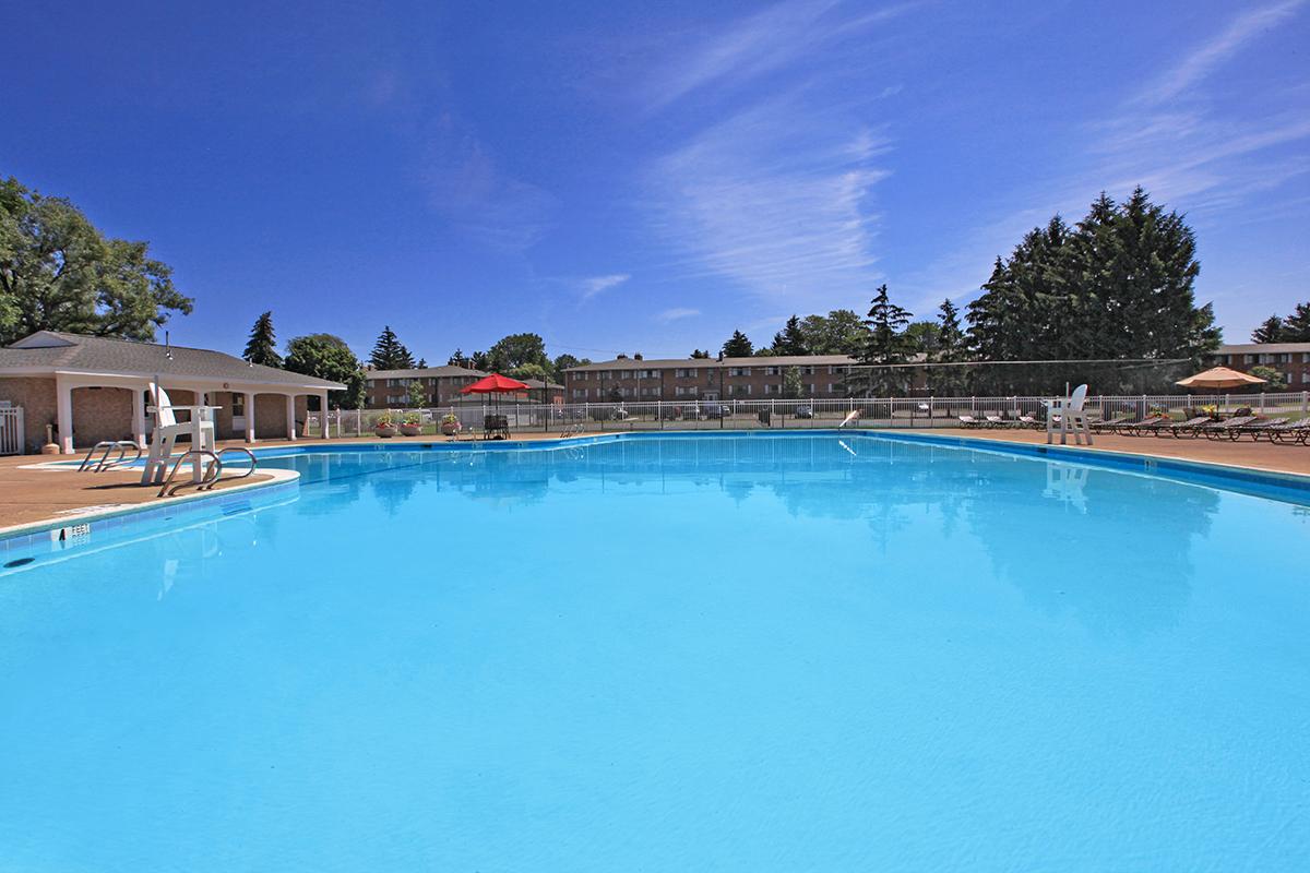 a pool next to a body of water