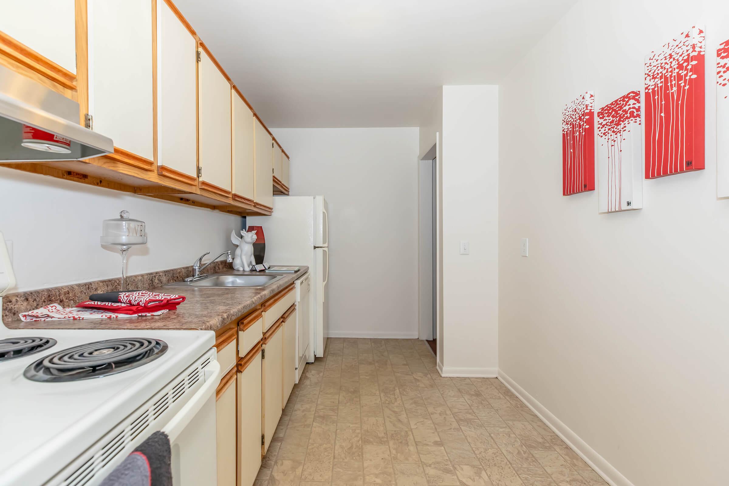 a kitchen with a stove and a refrigerator