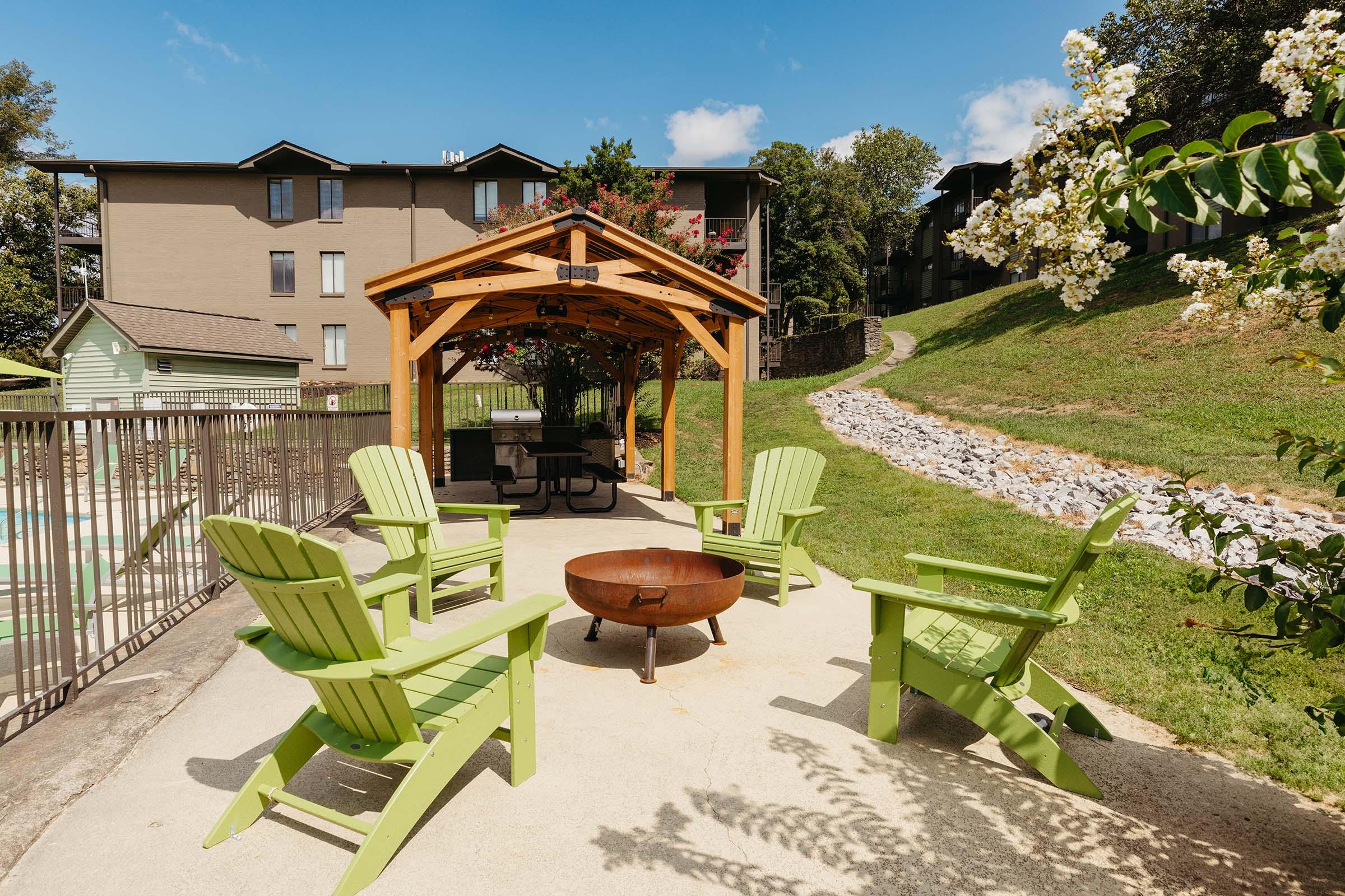 a group of lawn chairs sitting on top of a picnic table