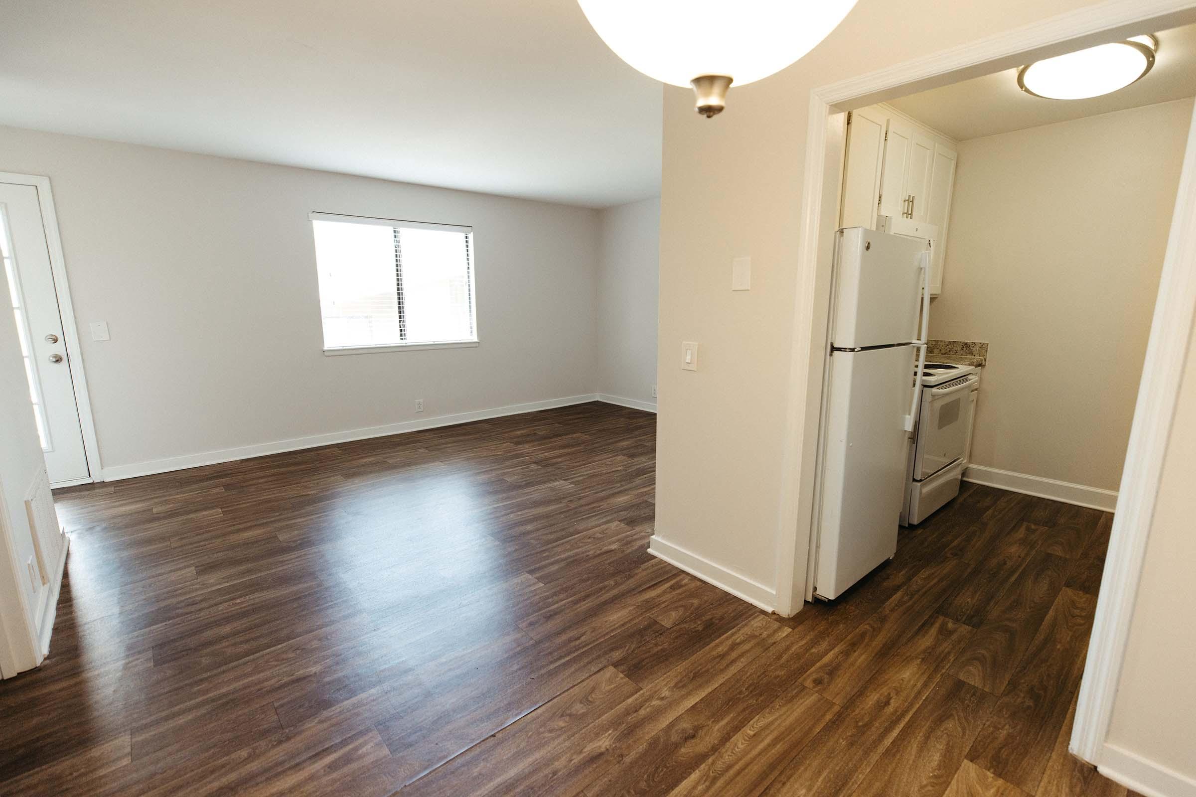 a kitchen with a wood floor