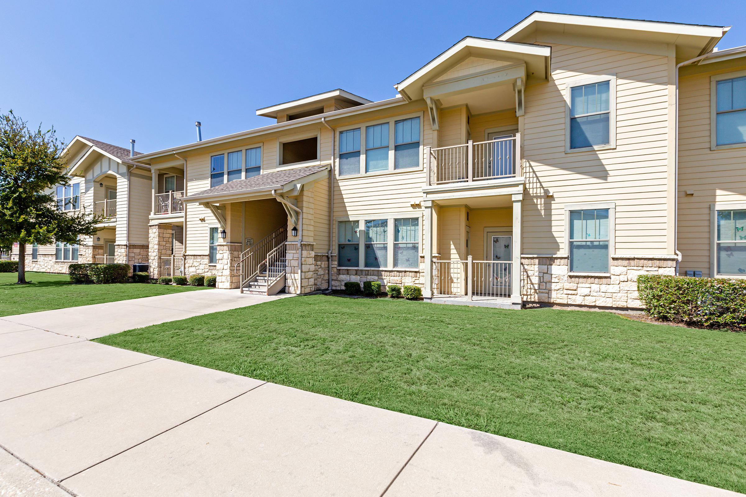 a large lawn in front of a house