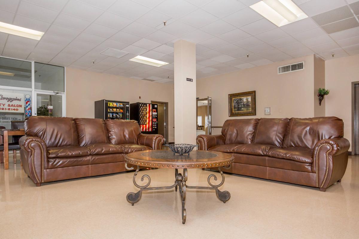 a brown leather couch in a living room