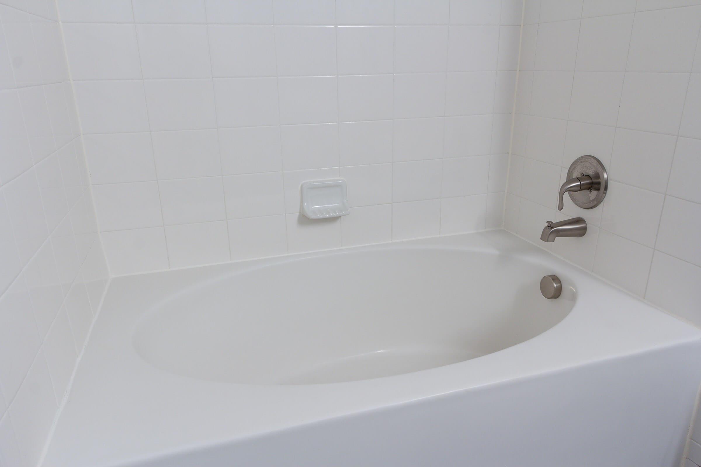 a close up of a sink and a bath tub