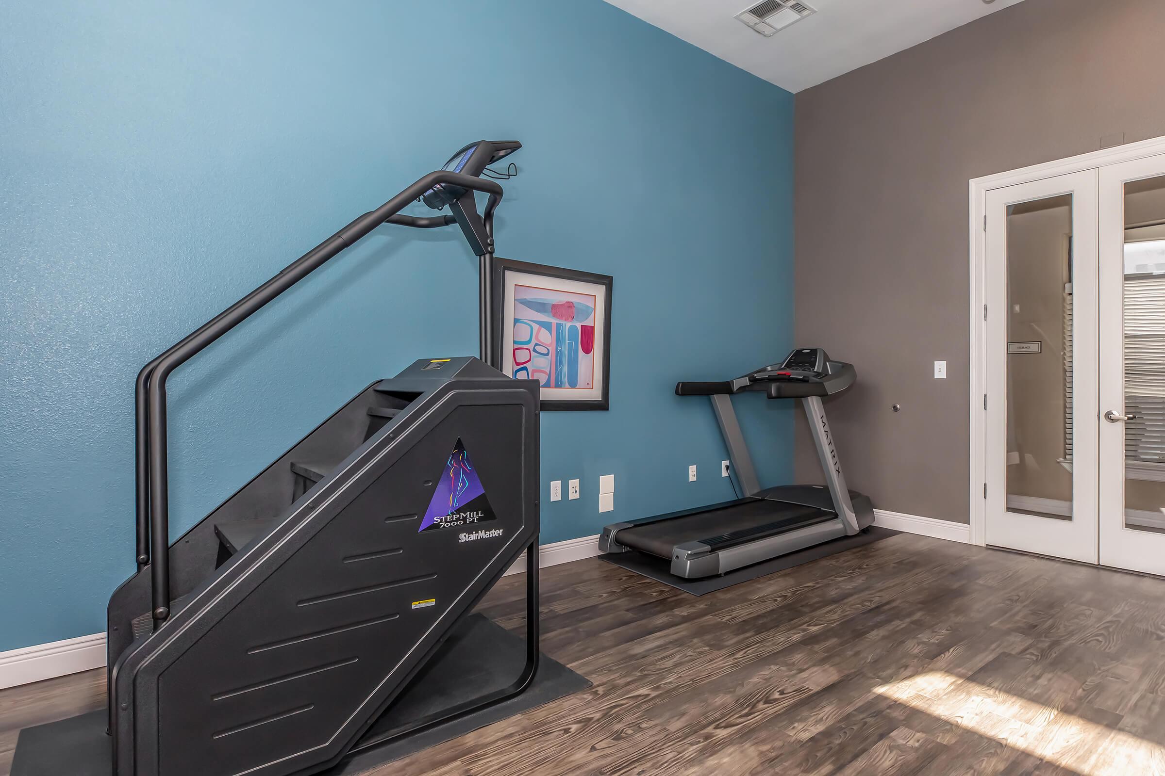 a bedroom with a bed and desk in a room