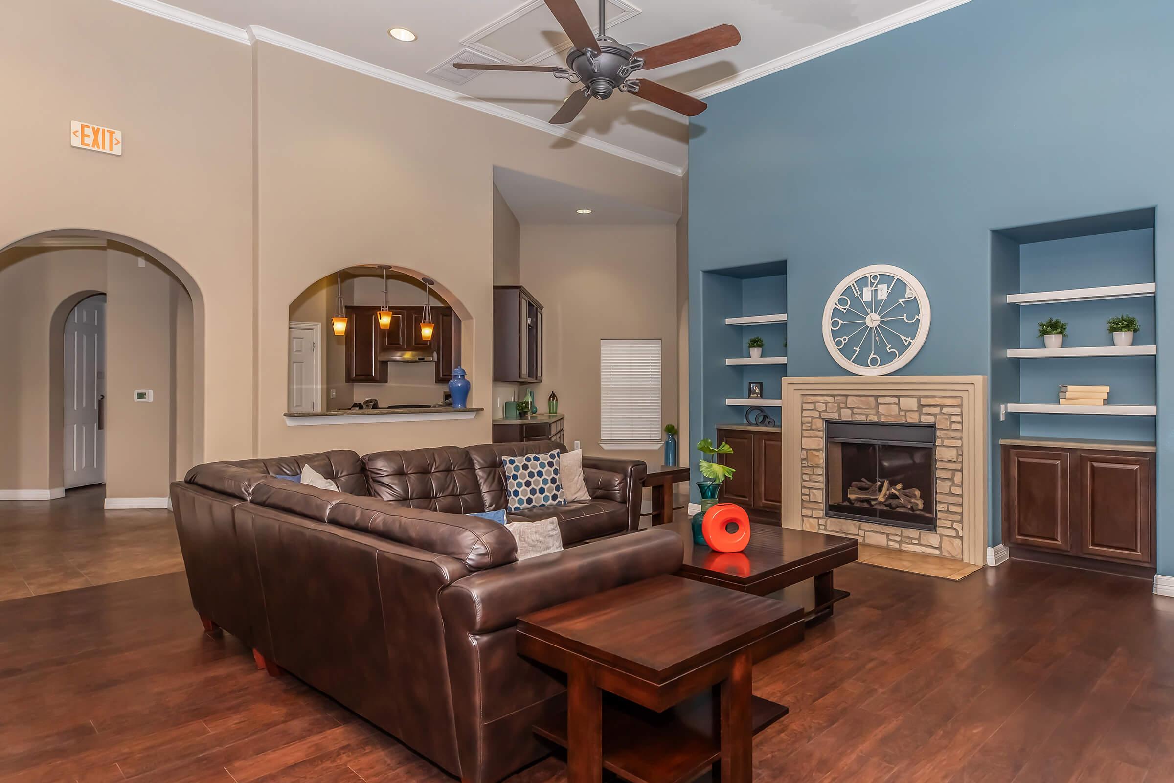 a living room filled with furniture and a fireplace