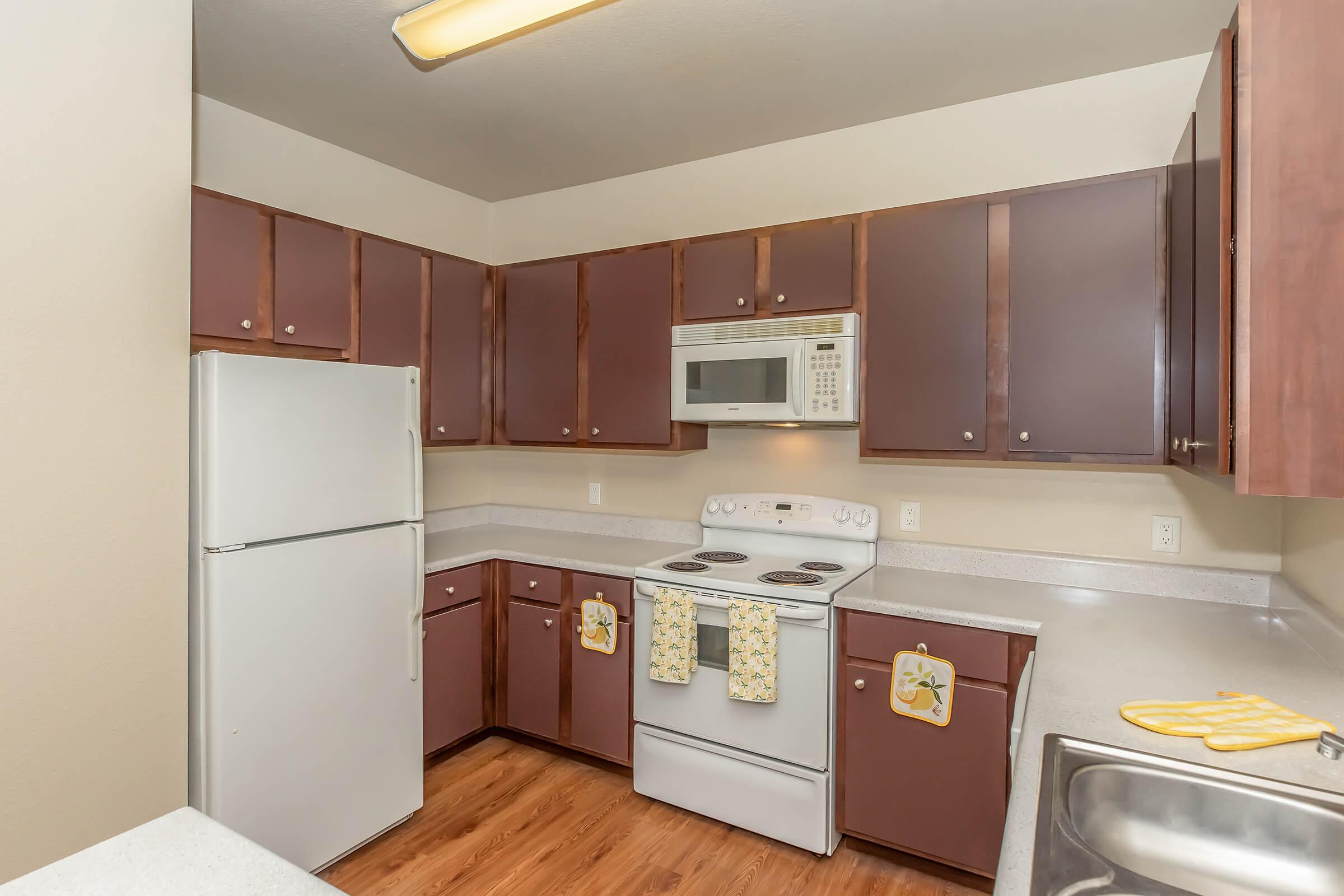 a kitchen with a stove top oven sitting inside of a refrigerator