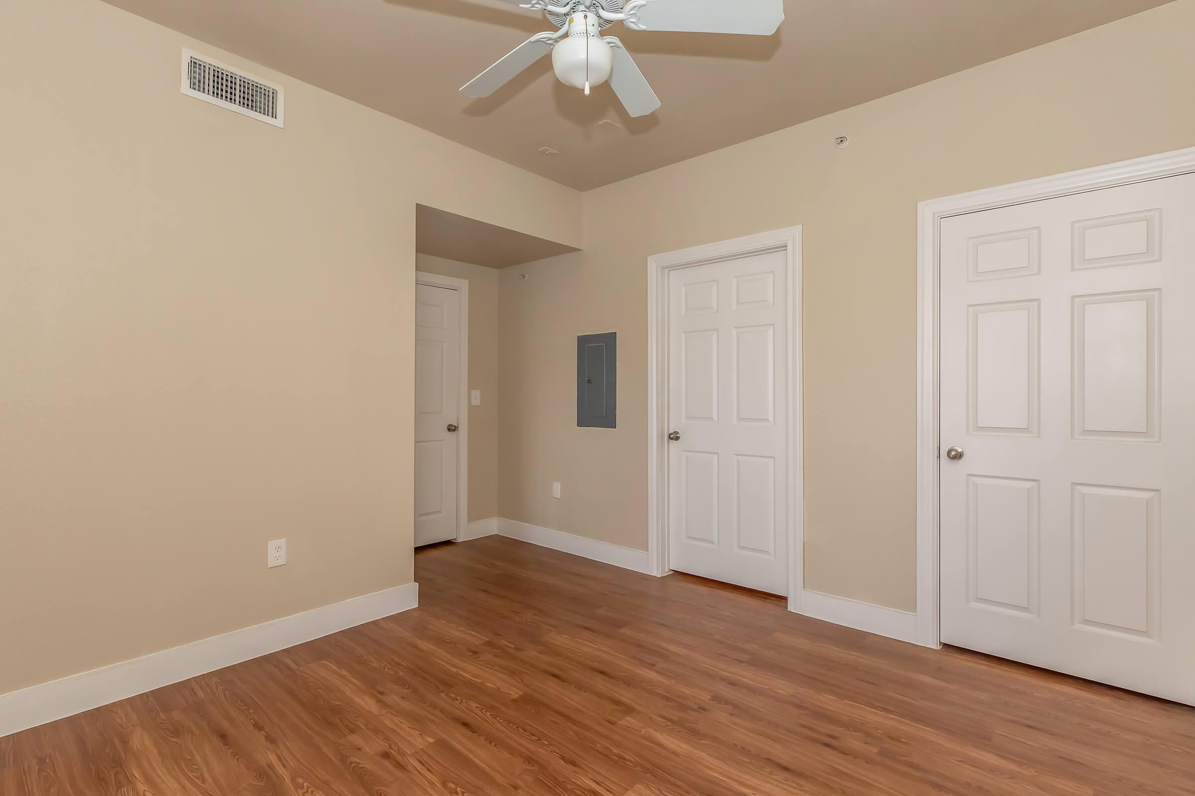 a large empty room with a wood floor