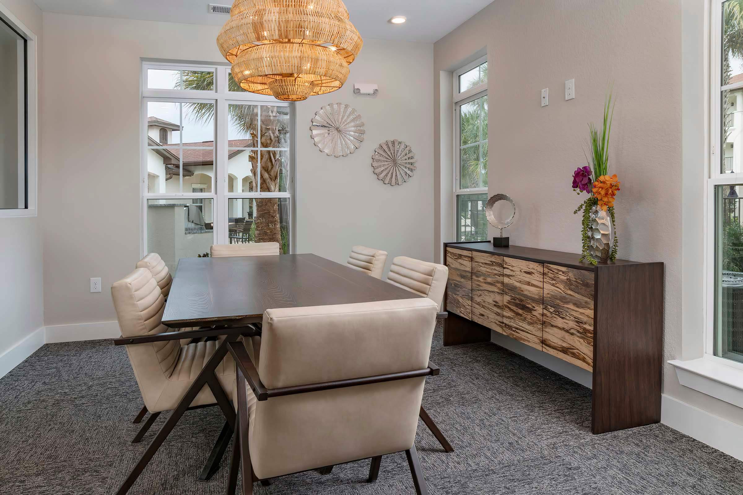 a living room filled with furniture and a large window