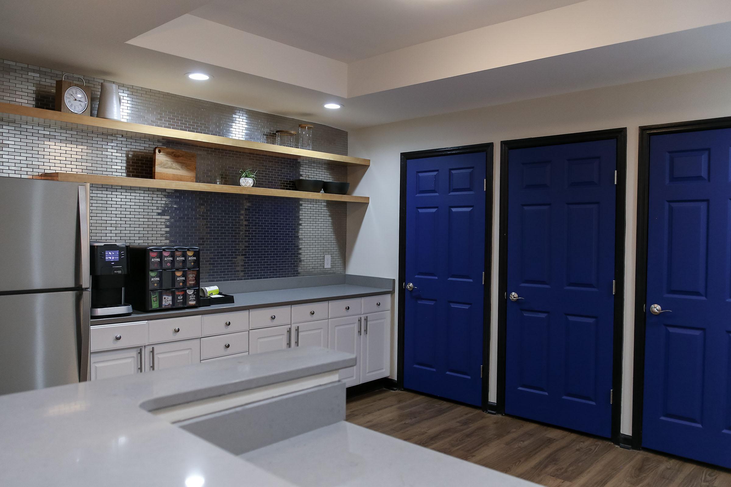 a large kitchen with stainless steel appliances