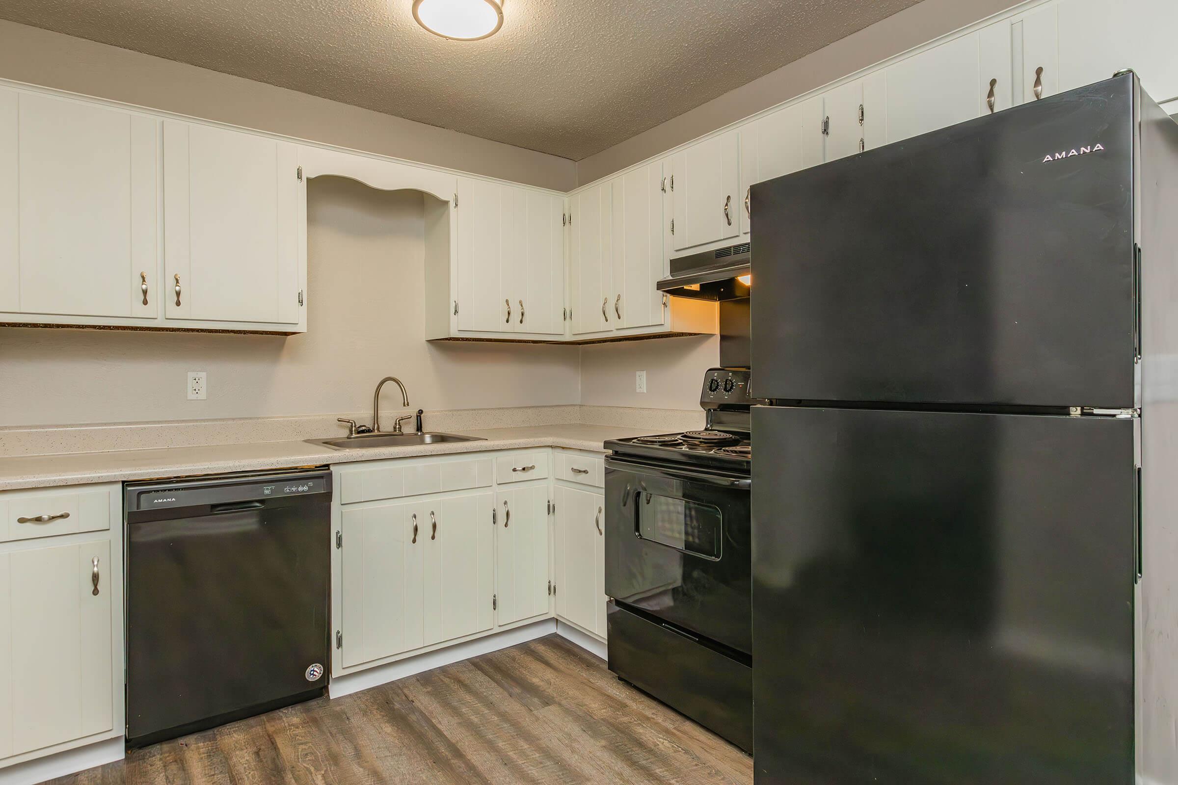 a stainless steel refrigerator in a kitchen