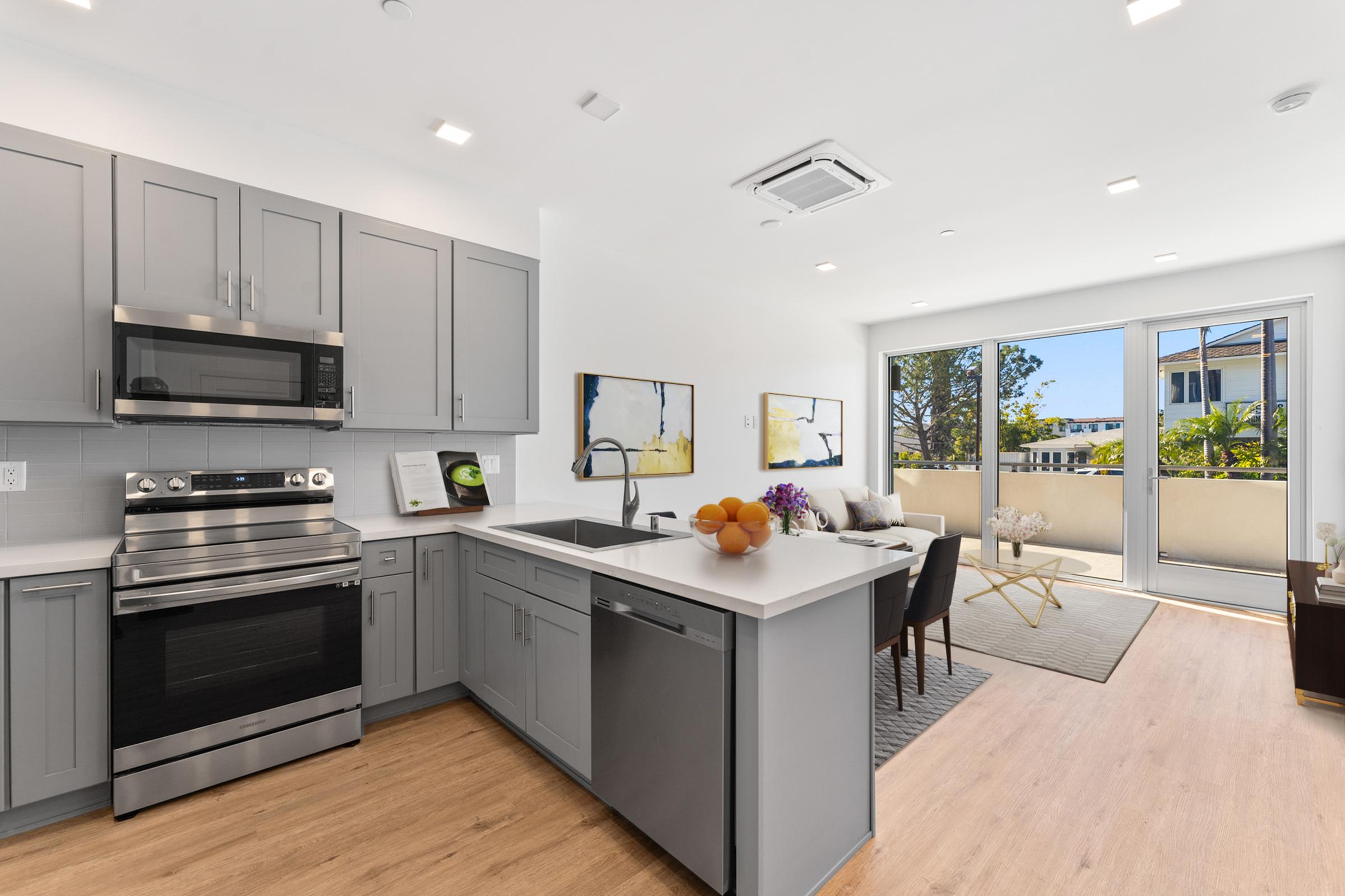 a kitchen with a table and chairs in a room