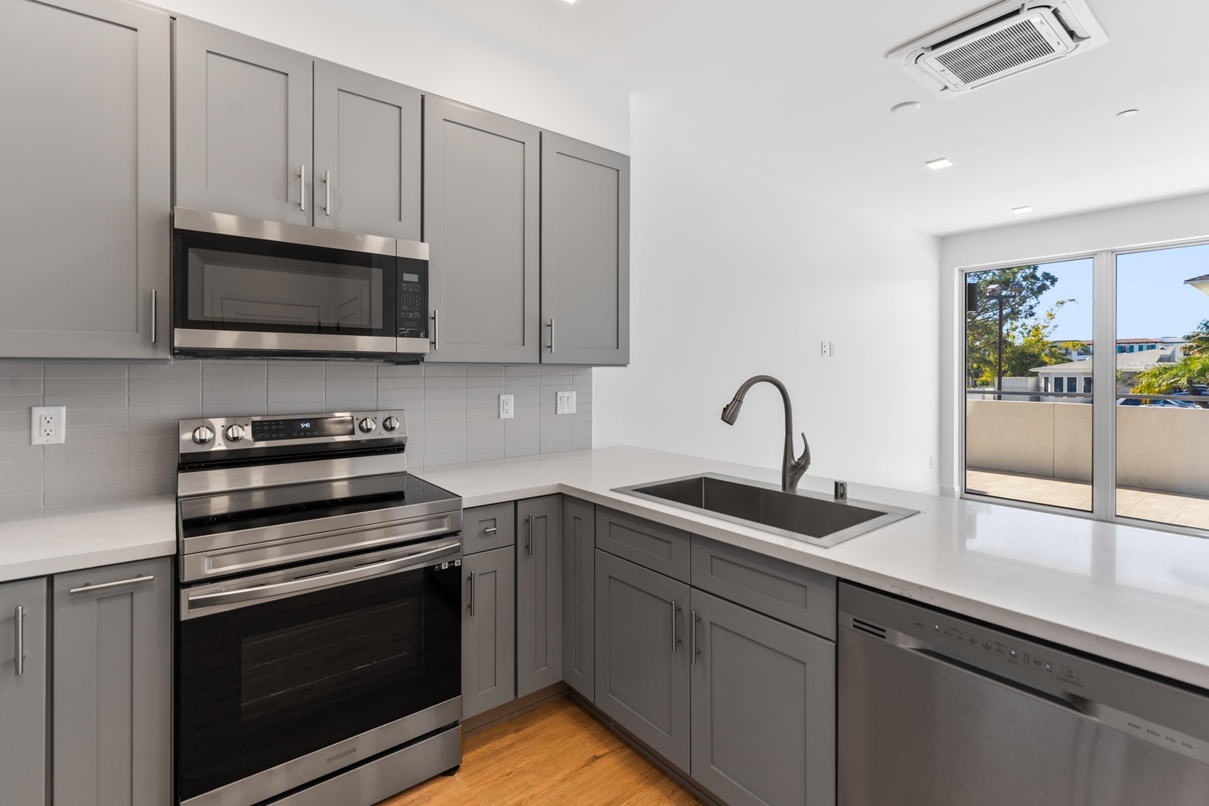 a kitchen with a sink and a window