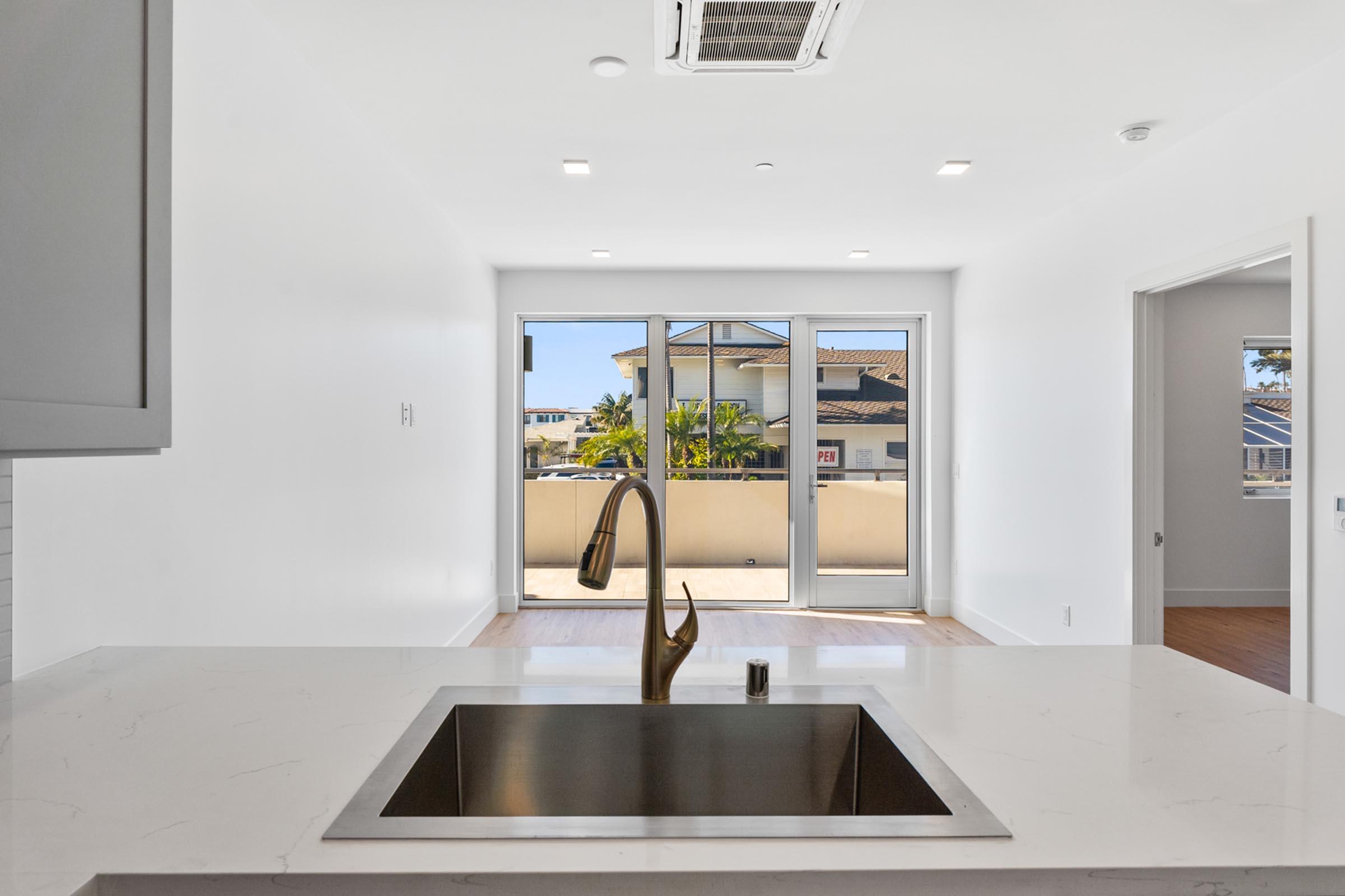 a kitchen with a sink and a window