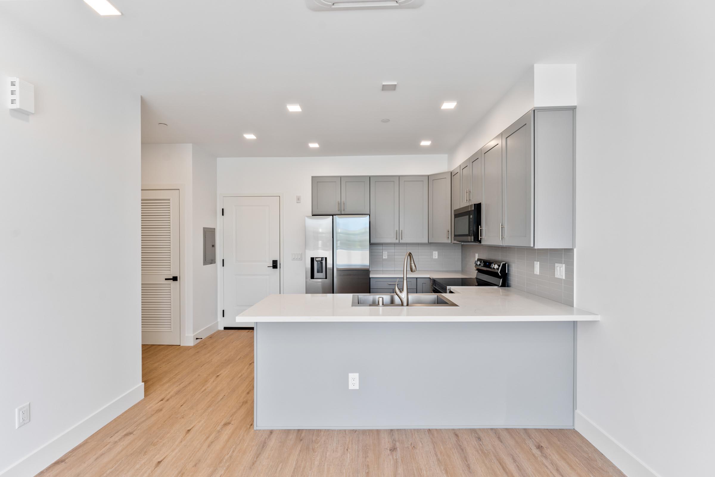 a kitchen with a wood floor