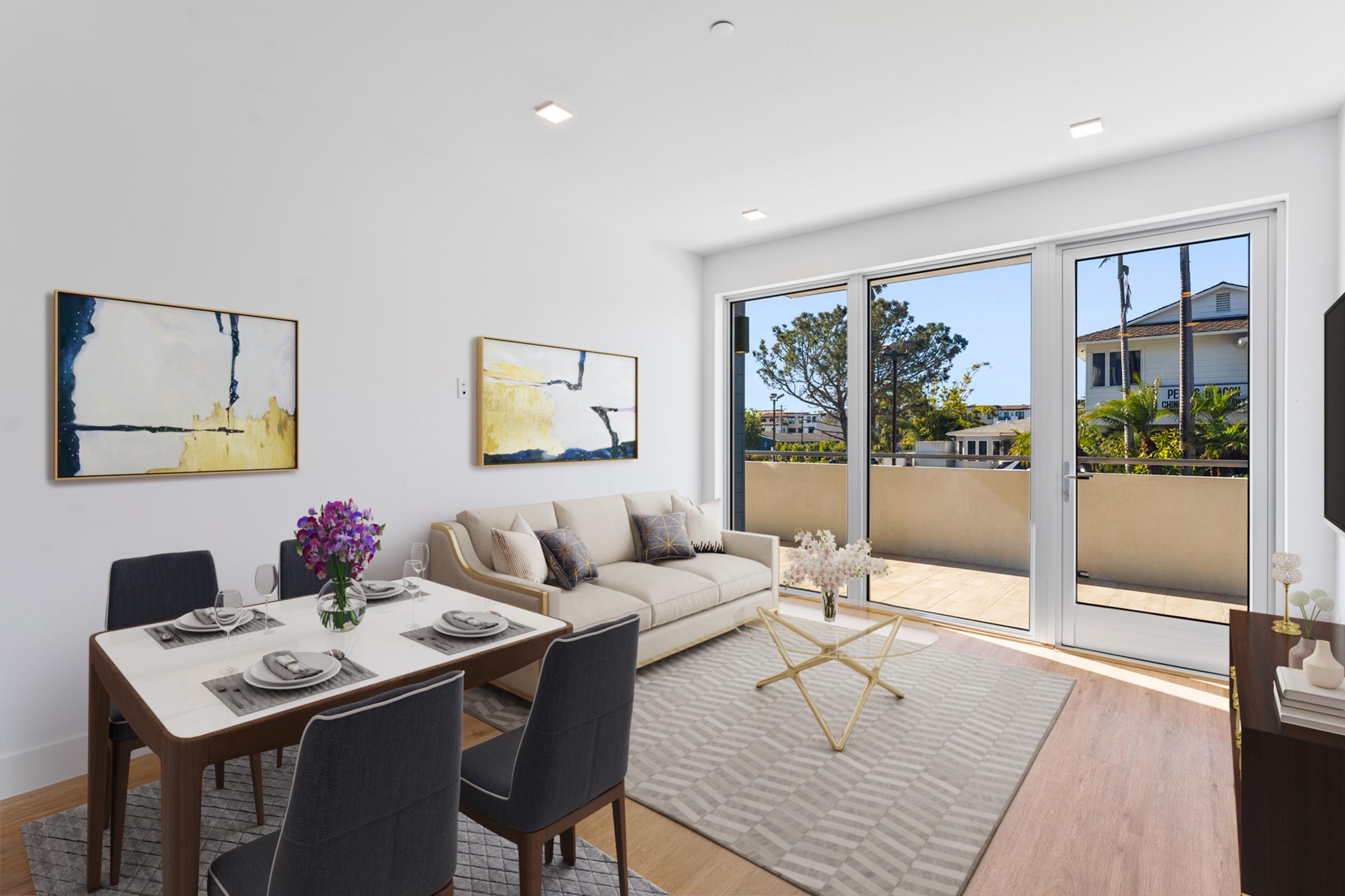 a living room filled with furniture and a large window