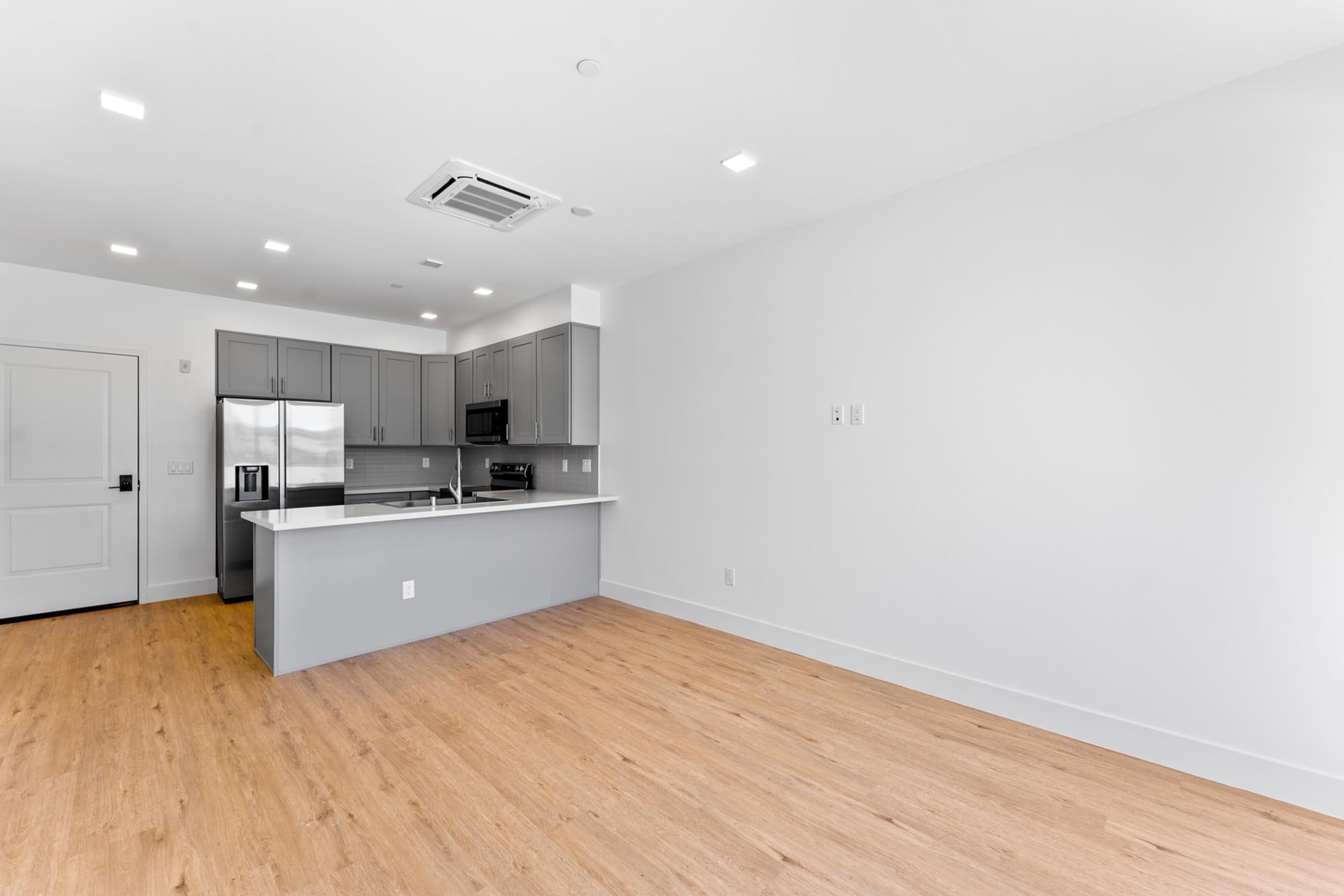 a kitchen with a wood floor