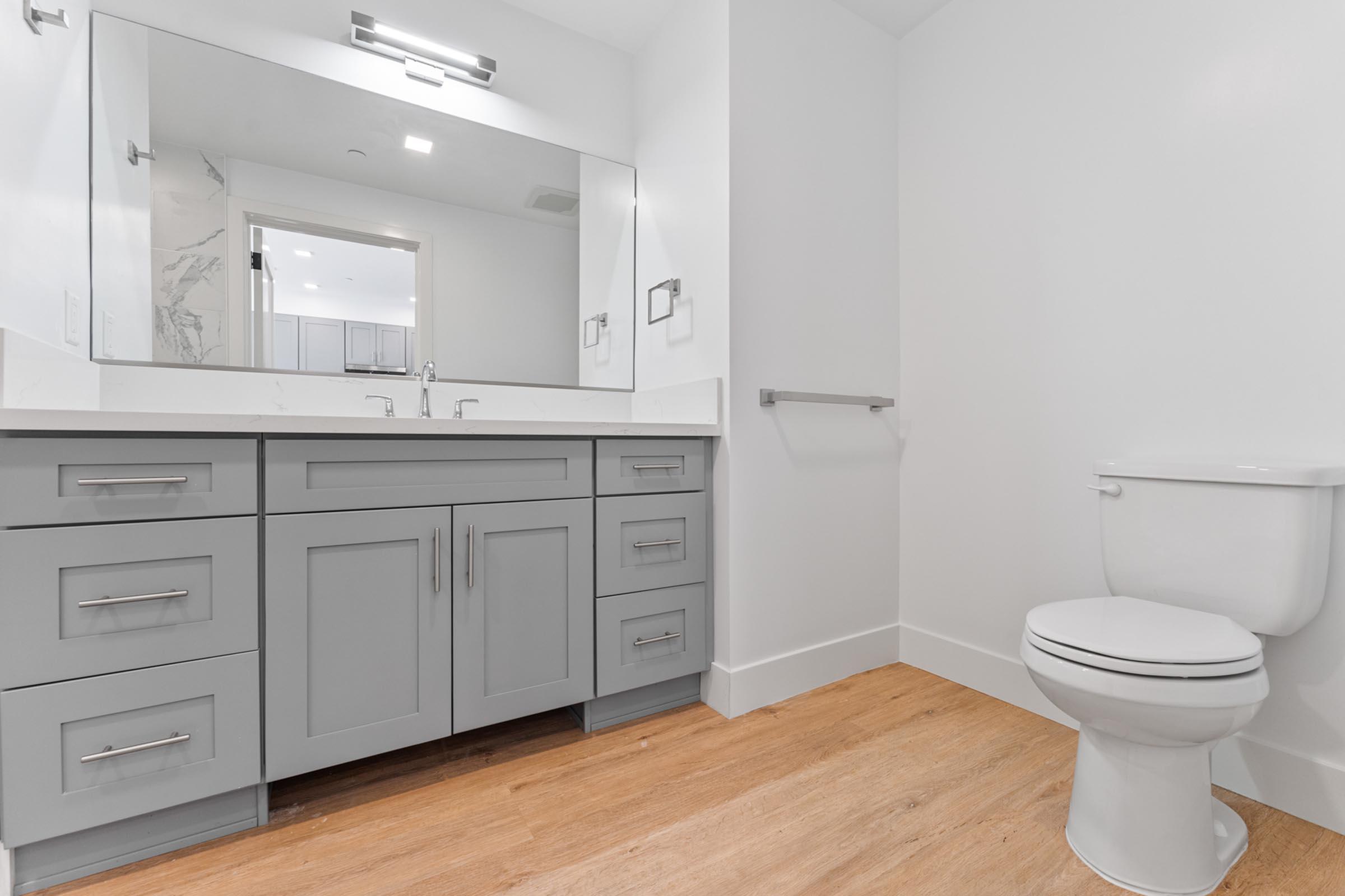 a kitchen with a sink and a mirror