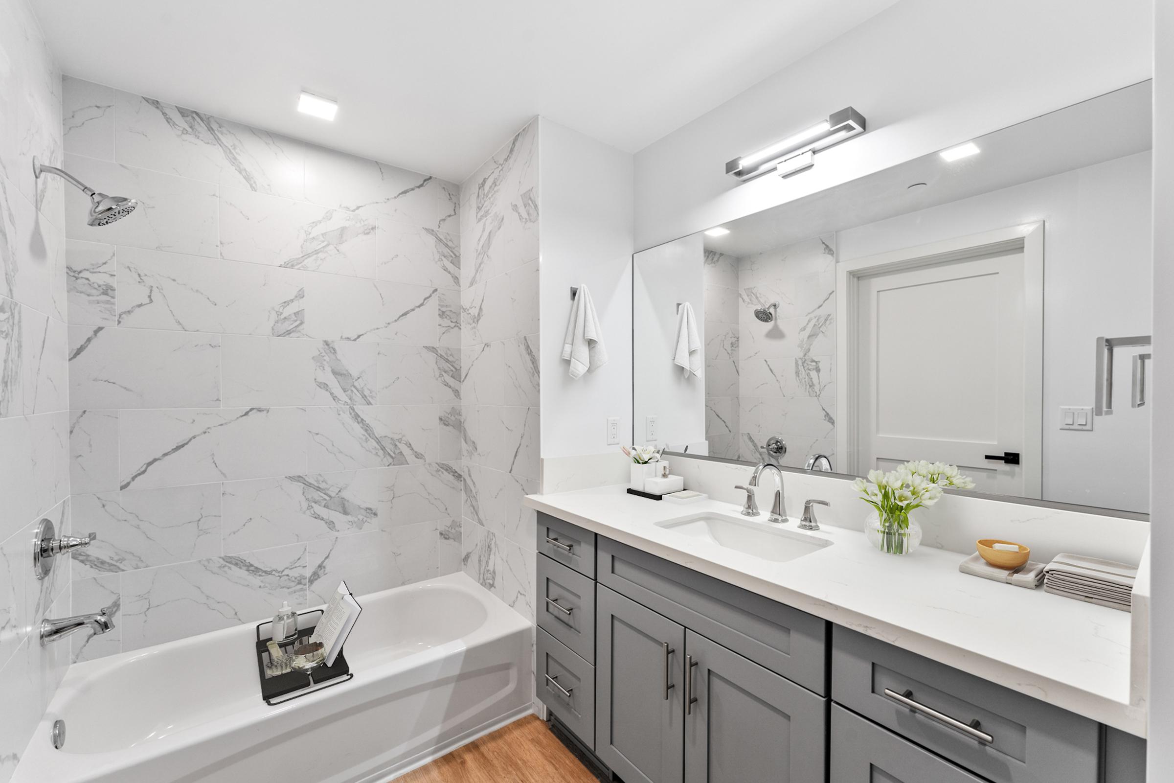 a kitchen with a sink and a mirror