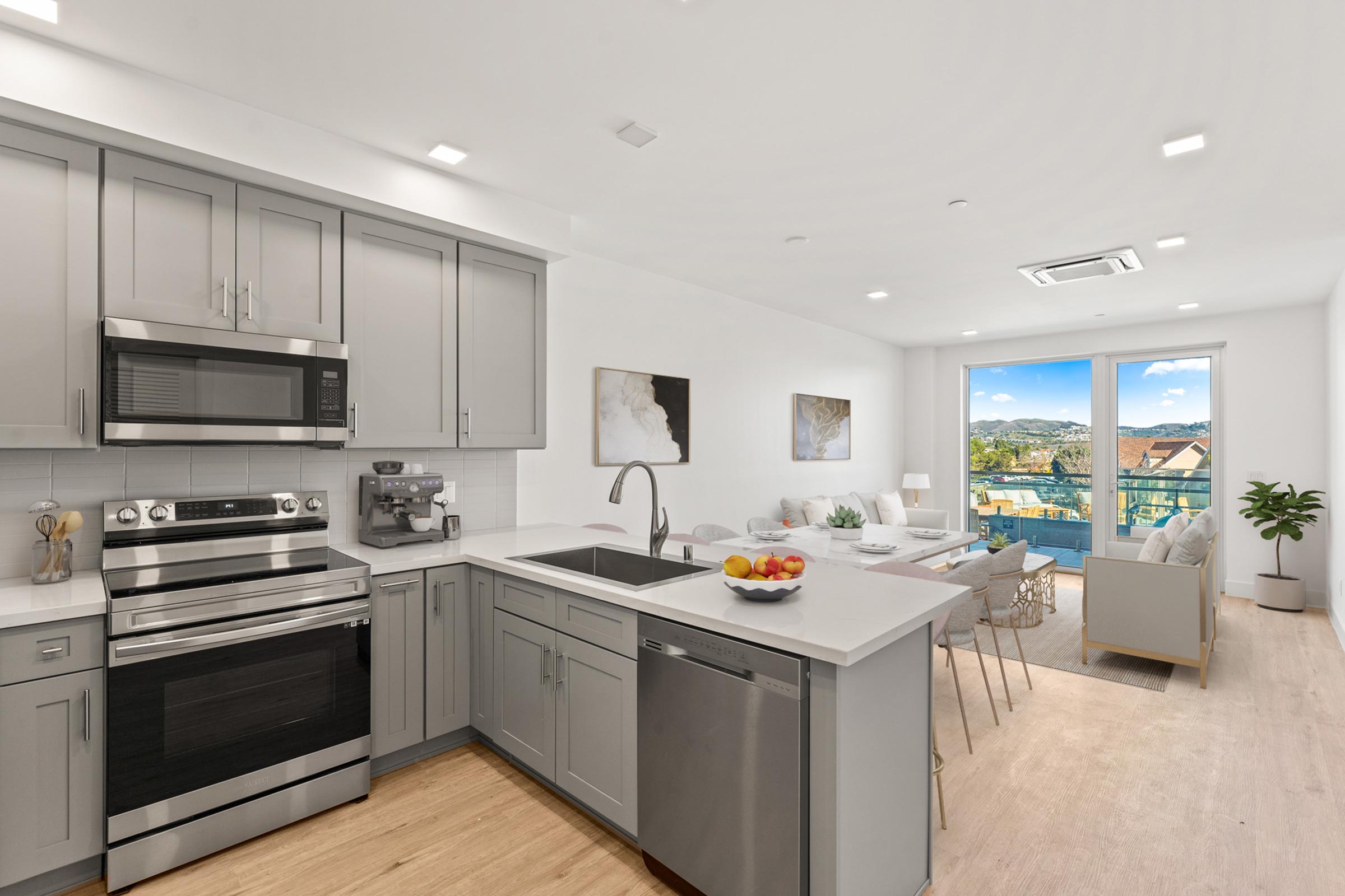 a kitchen with an island in the middle of a room