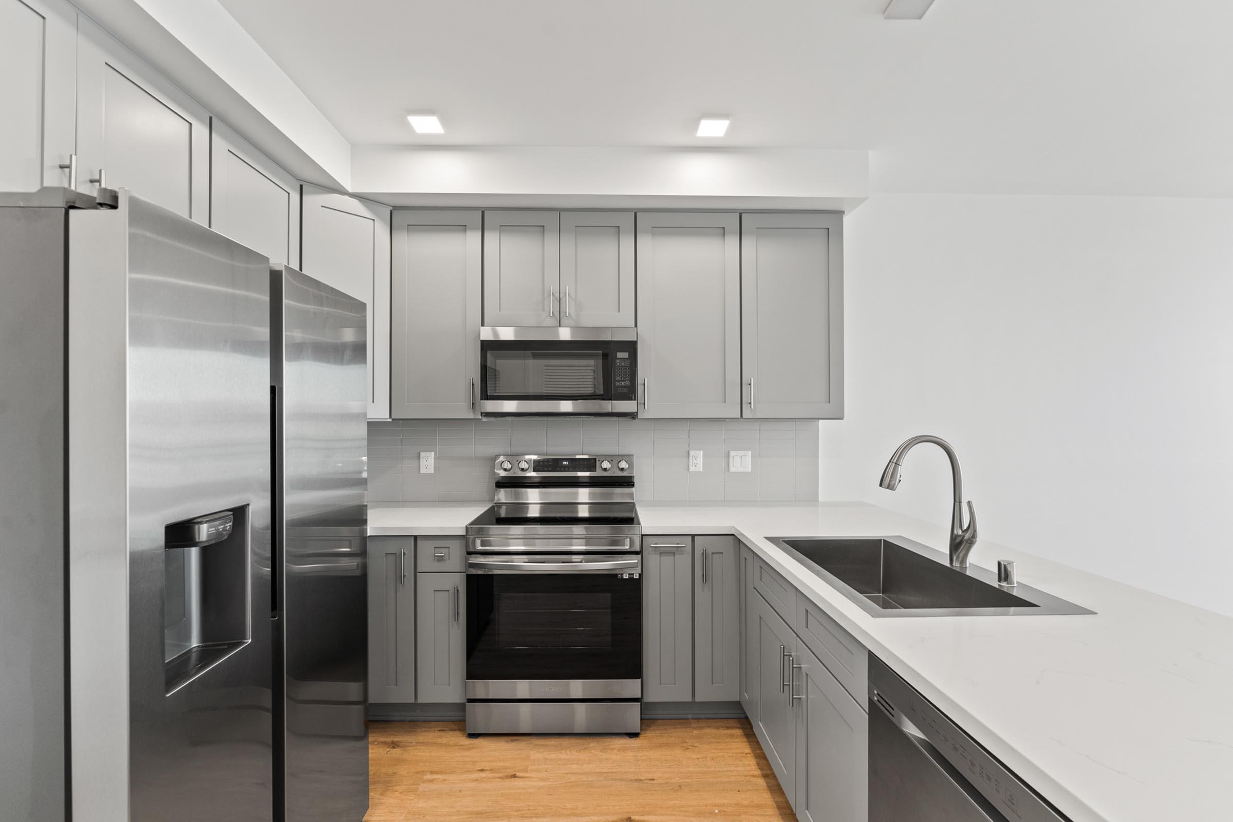 a kitchen with a stove and a sink