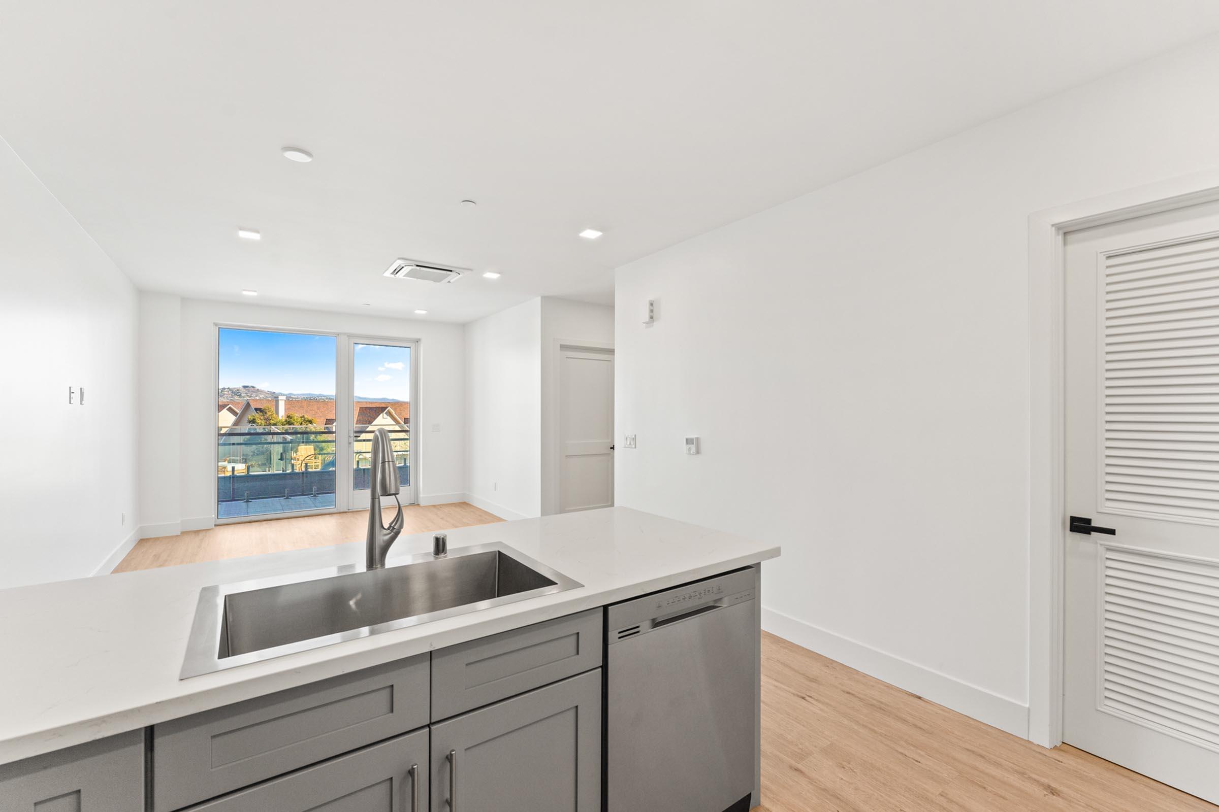 a kitchen with a sink and a window