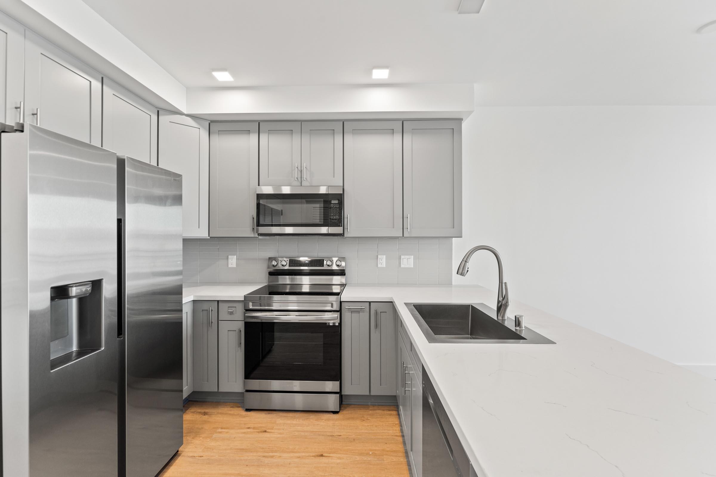 a large kitchen with stainless steel appliances