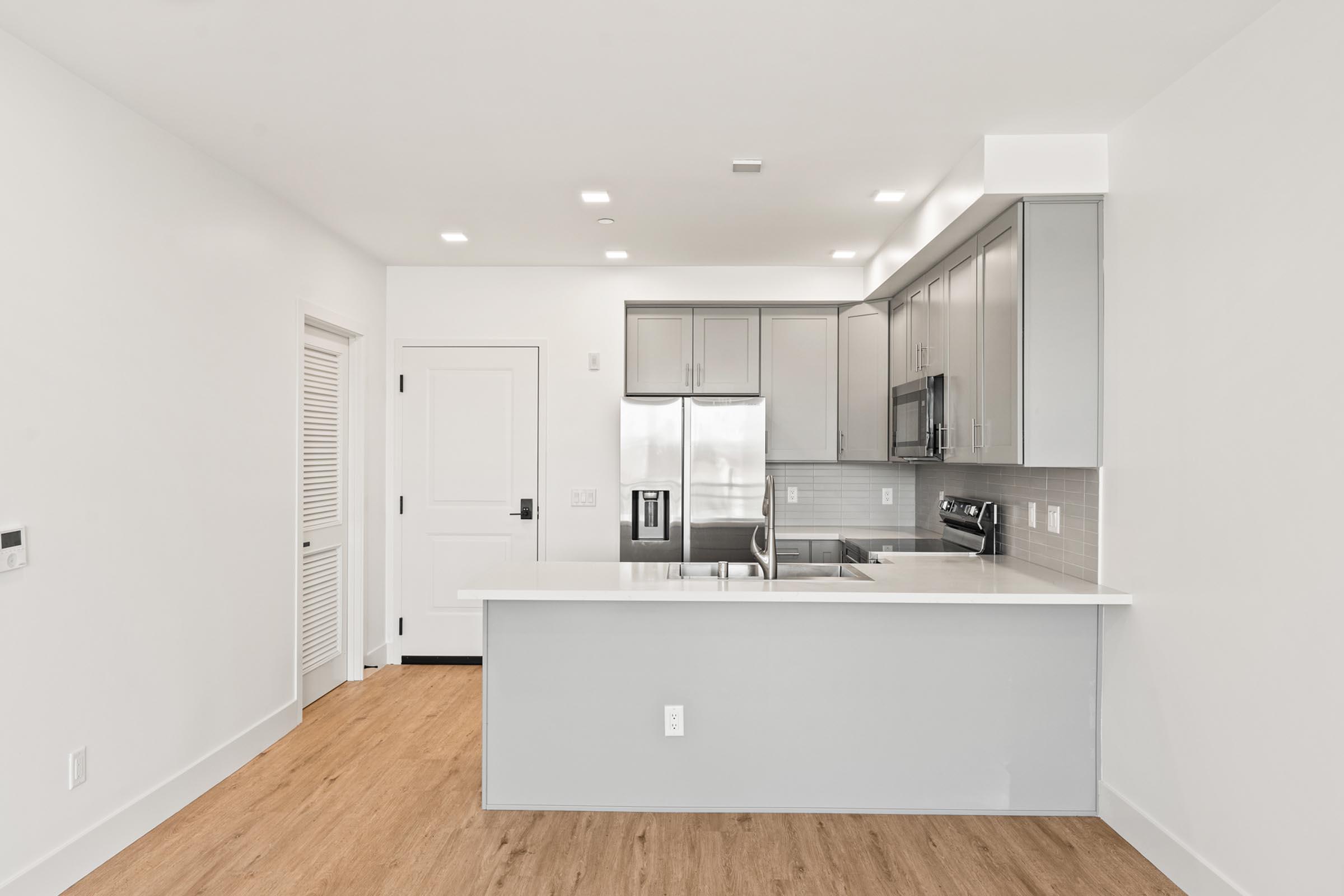 a kitchen with a wood floor