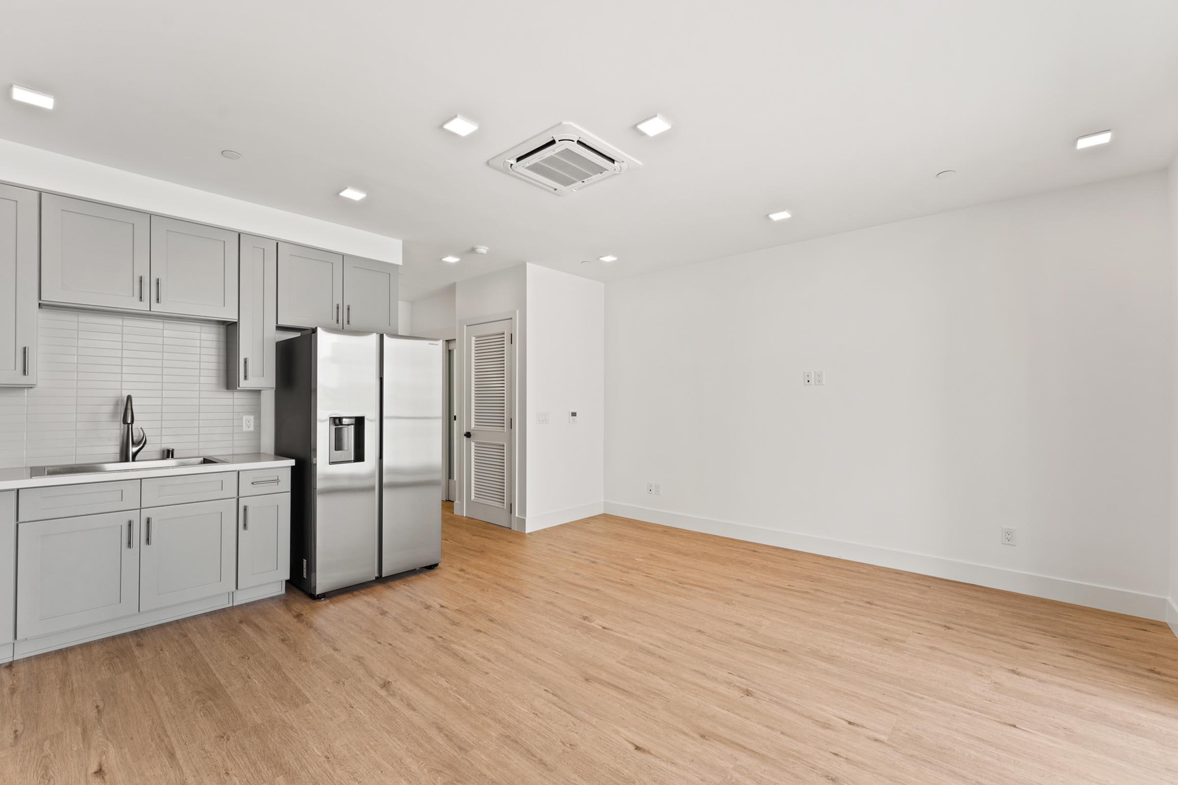 a kitchen with a wooden floor