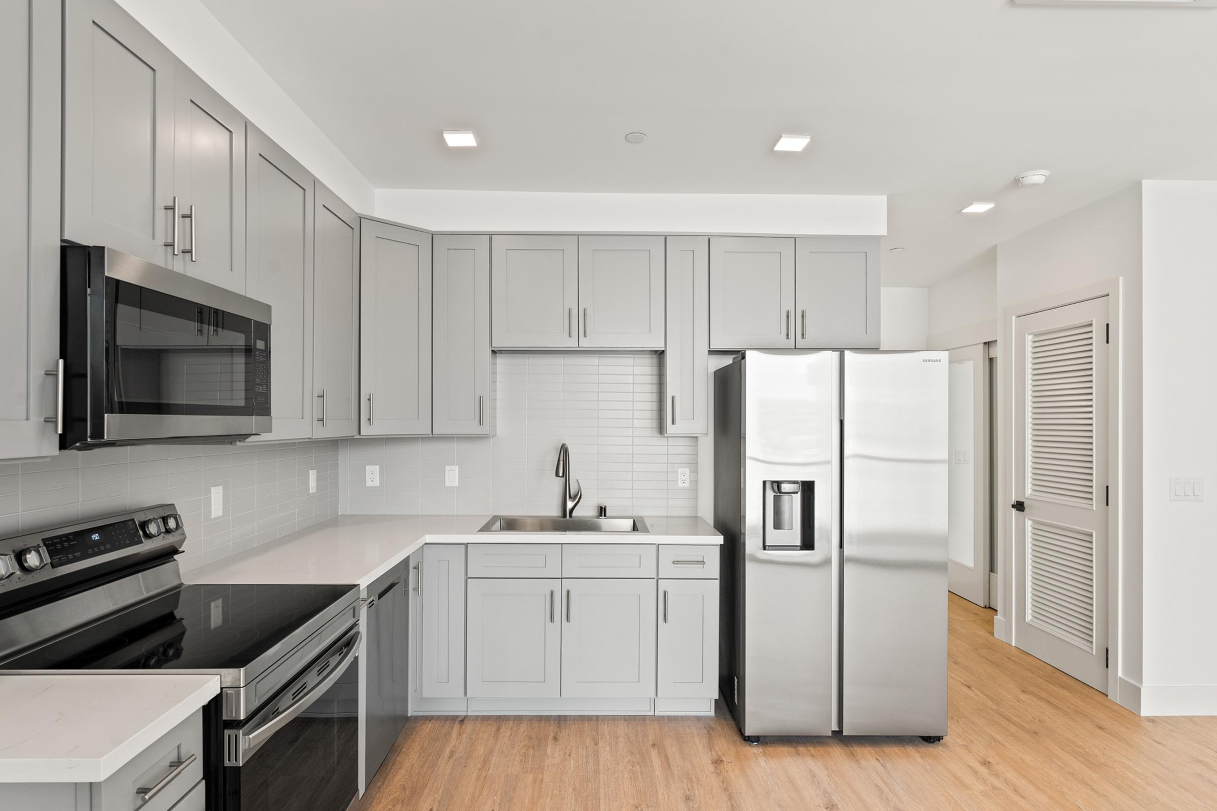 a kitchen with a stove and a refrigerator