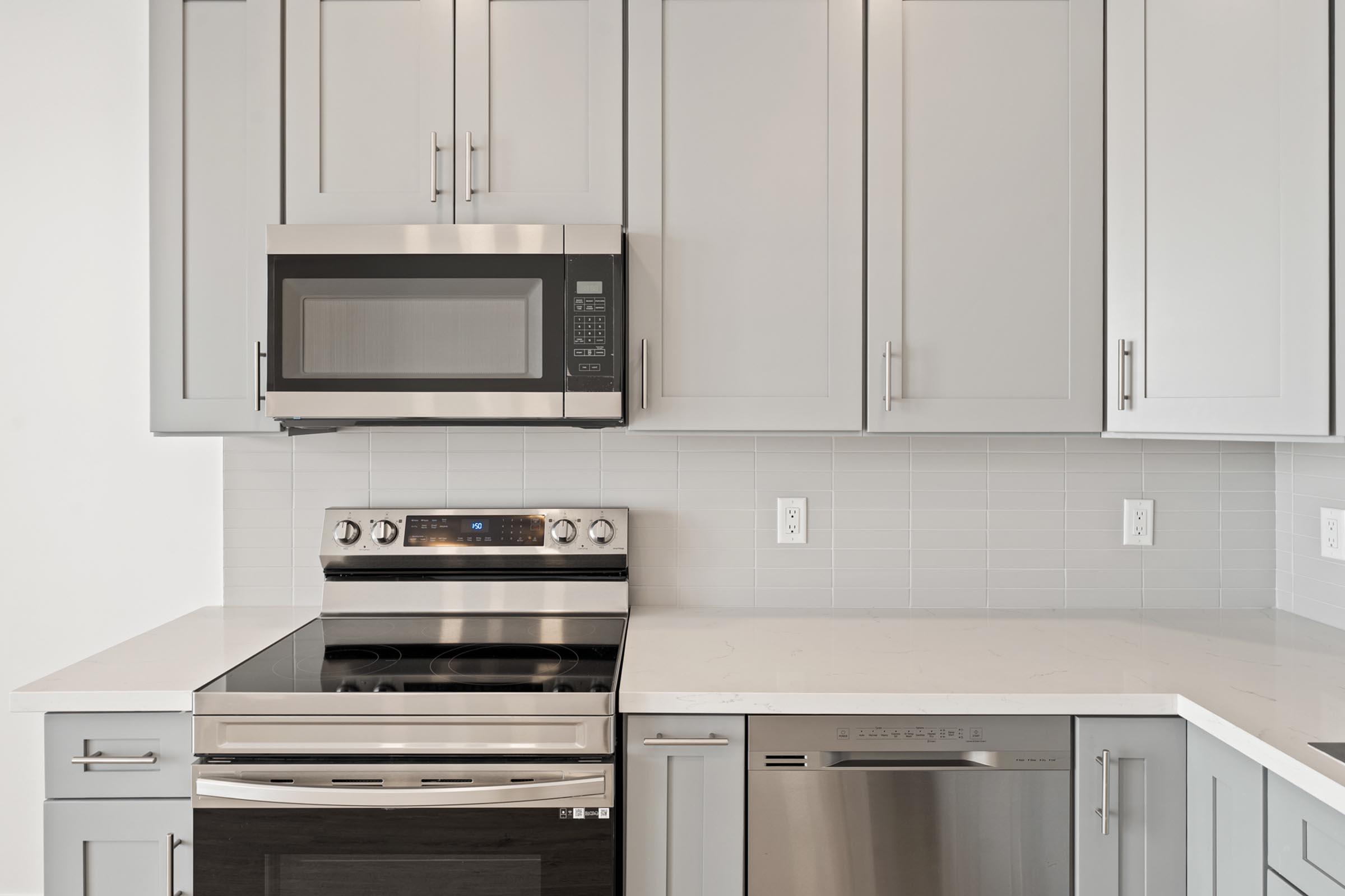 a kitchen with a stove top oven sitting inside of a microwave