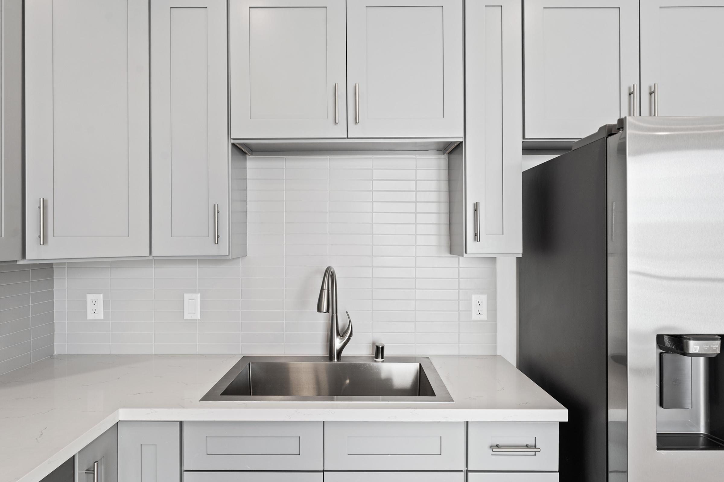 a kitchen with a sink and a microwave