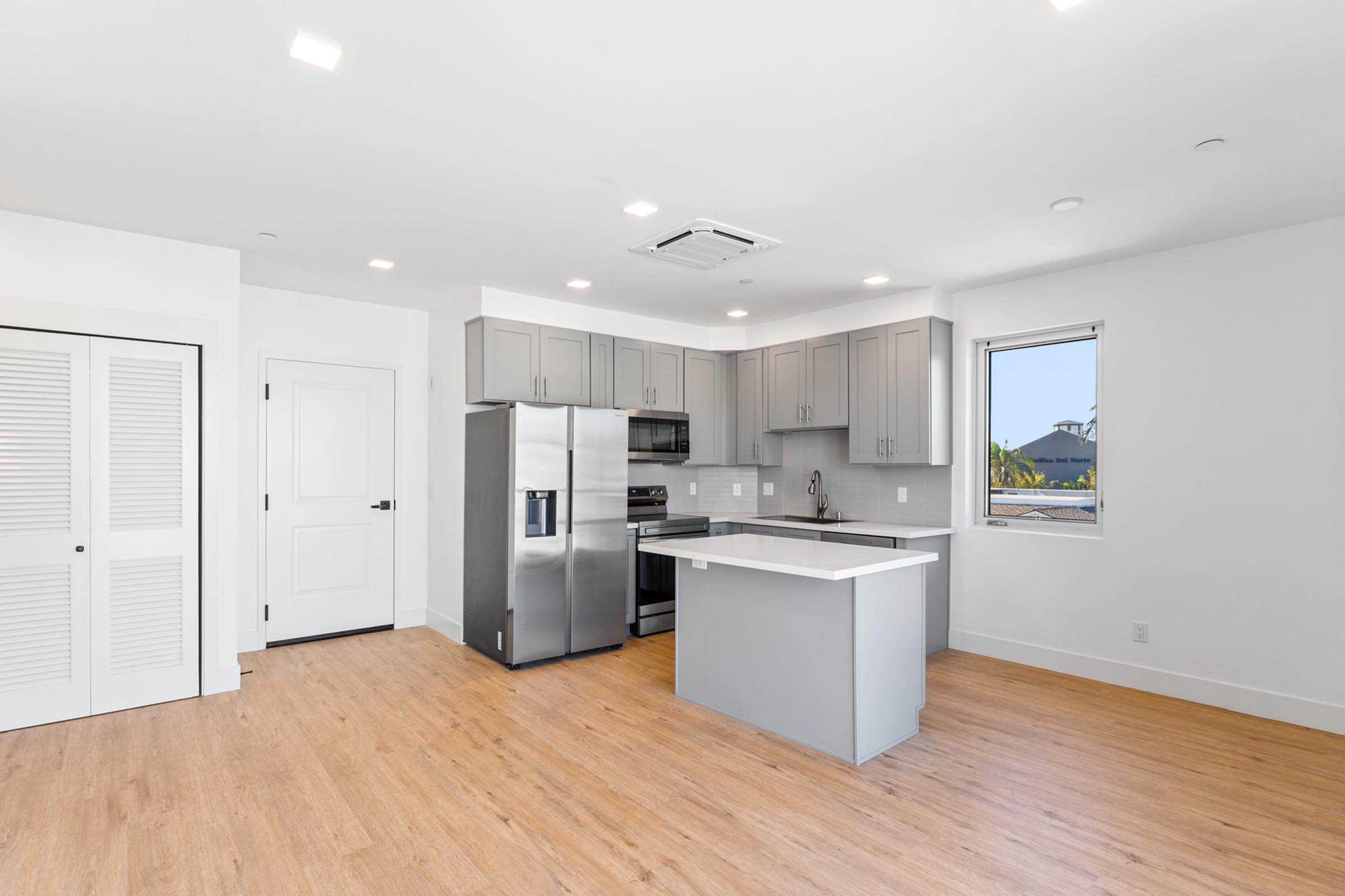 a kitchen with a wood floor