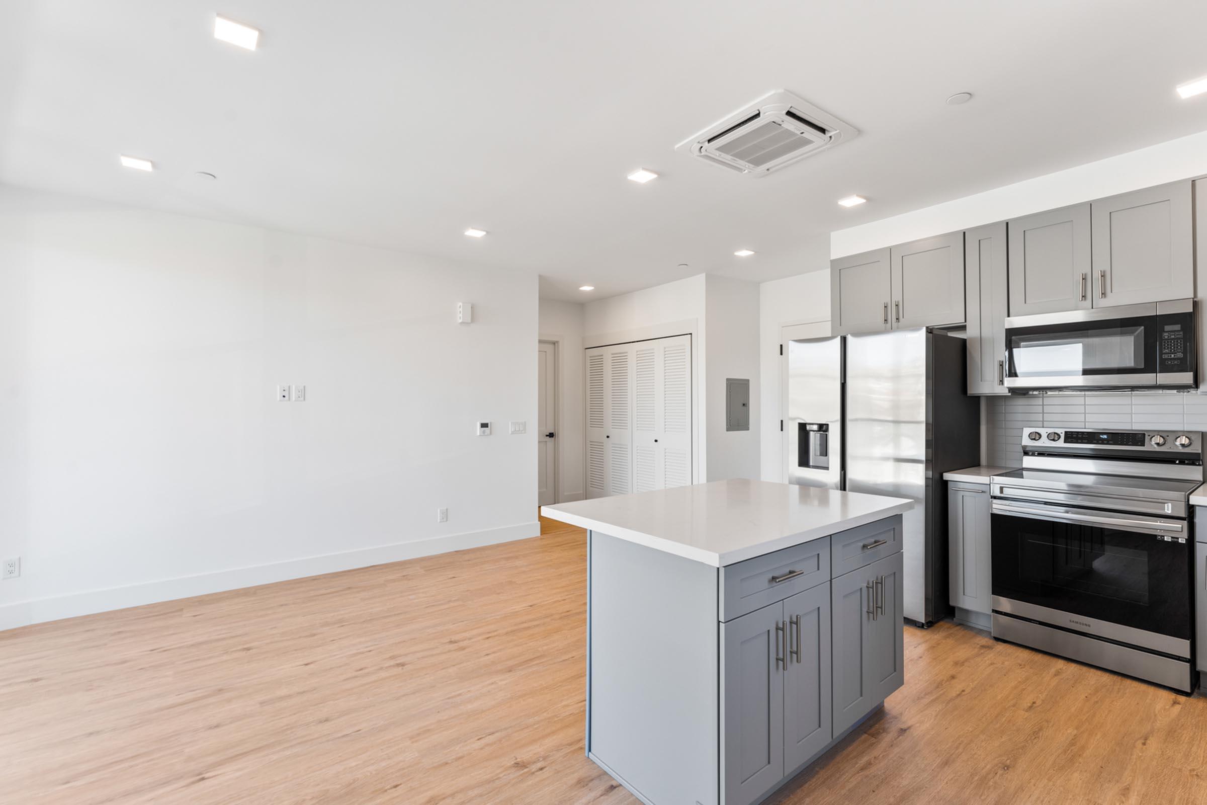 a kitchen with a wood floor