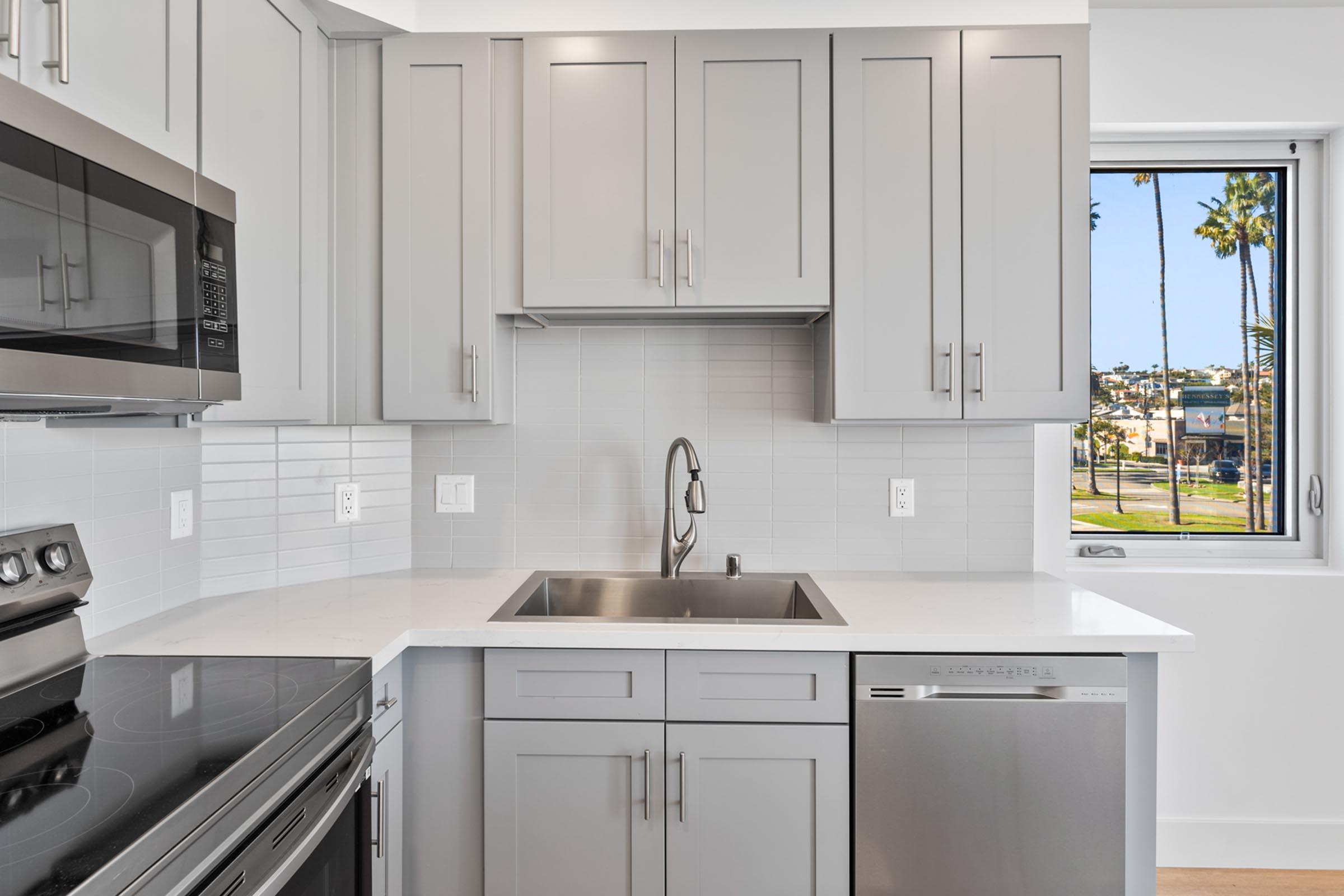 a kitchen with a sink and a window