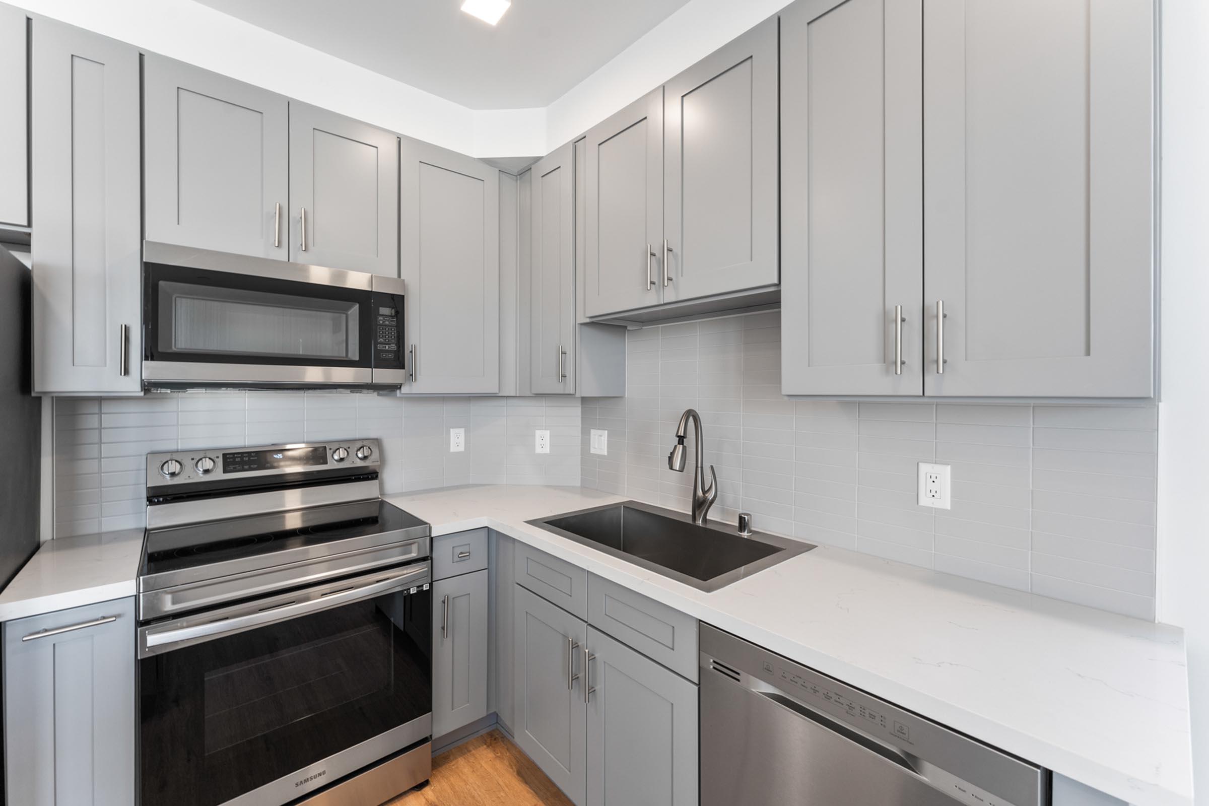 a kitchen with a sink and a microwave