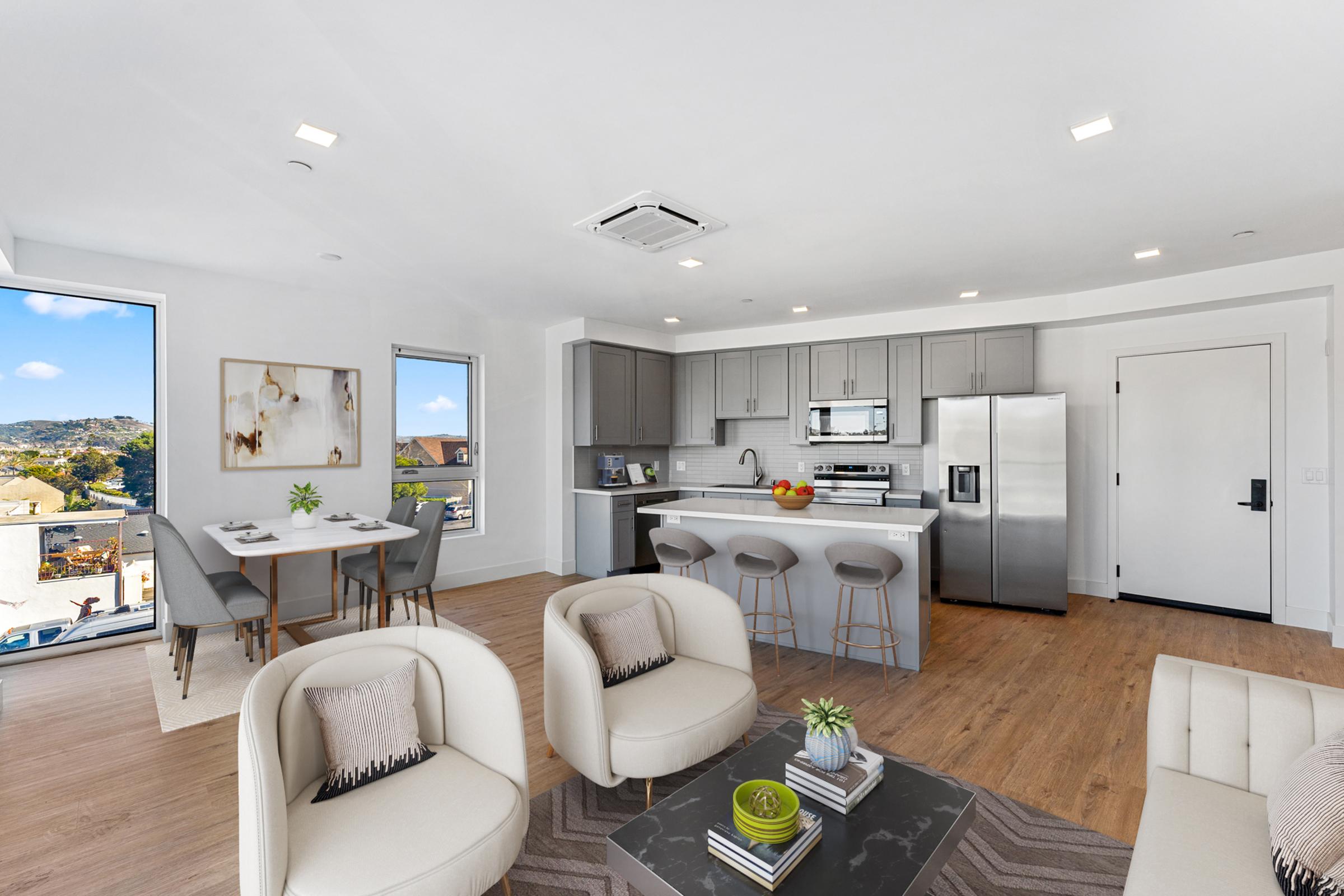 a living room filled with furniture and a flat screen tv