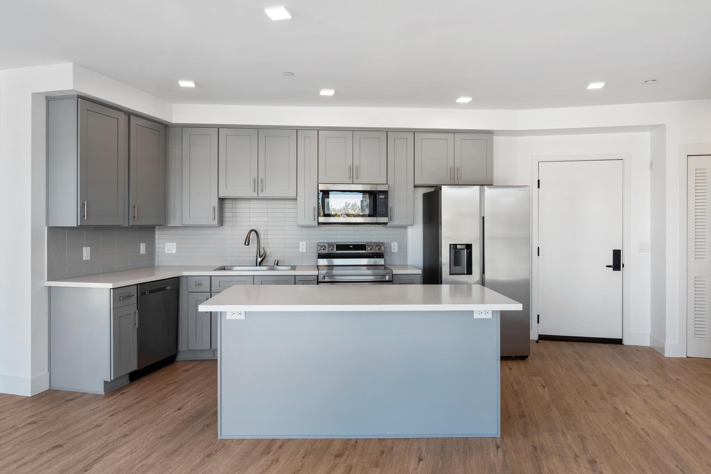 a kitchen with a stove and a refrigerator