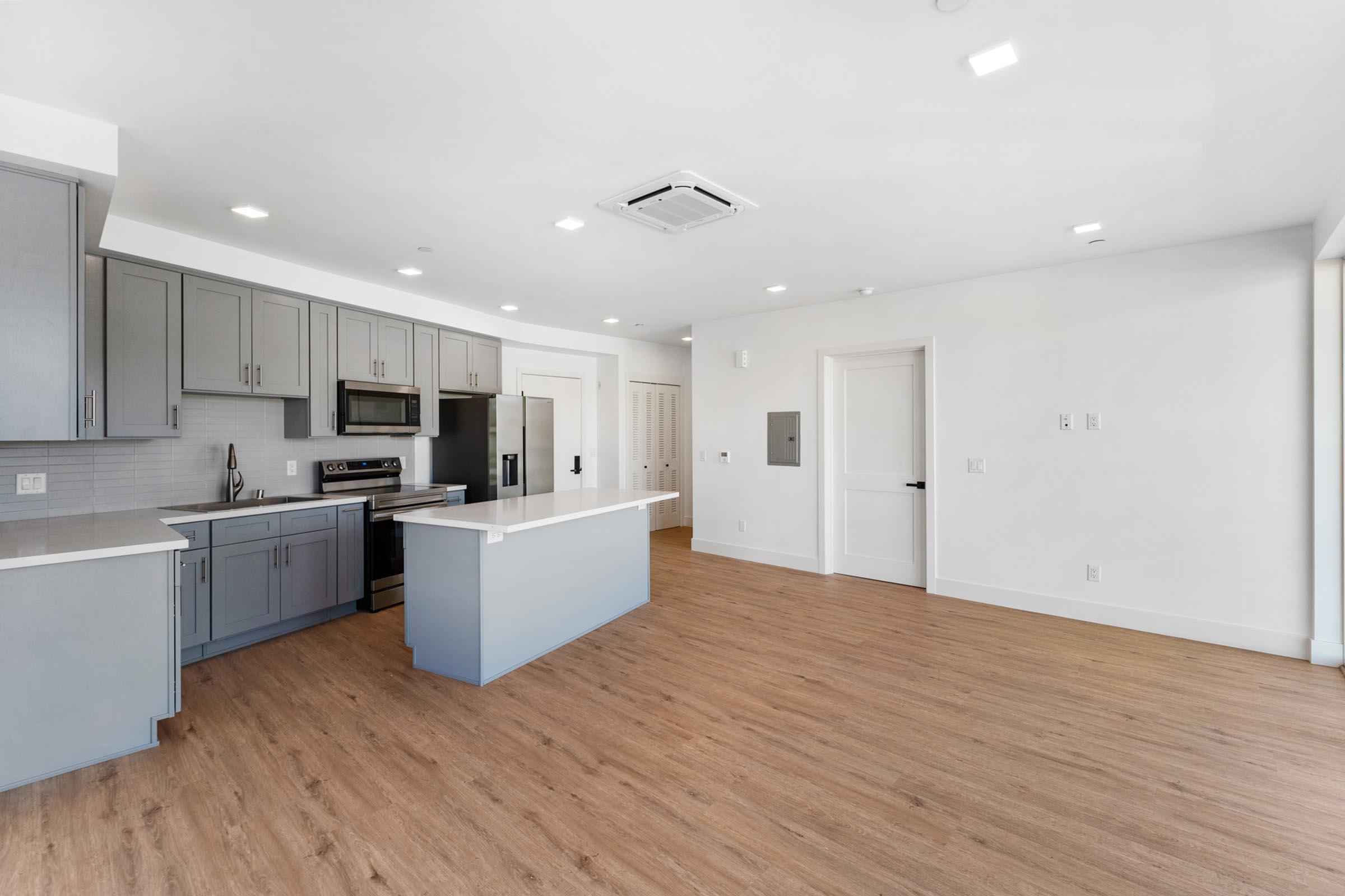 a kitchen with a wooden floor