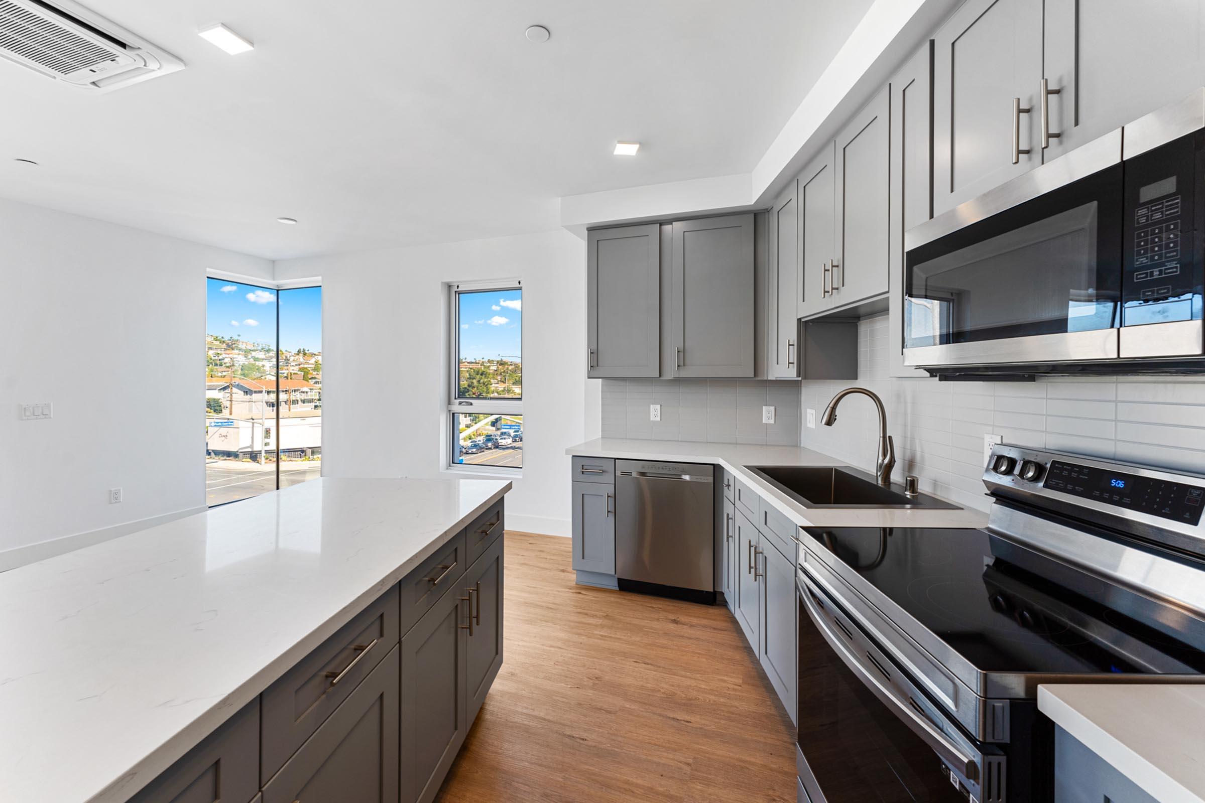 a modern kitchen with stainless steel appliances