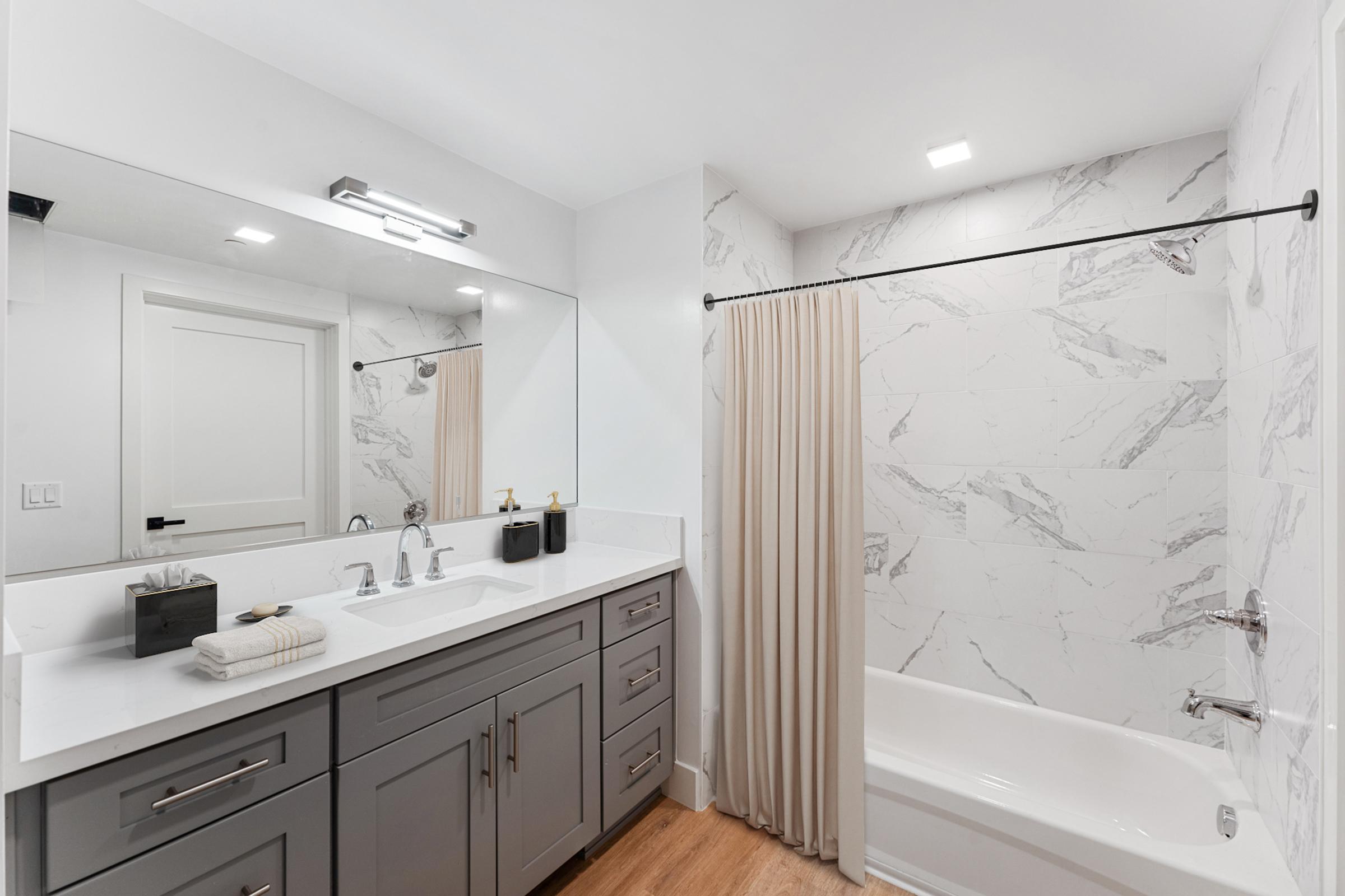 a kitchen with a sink and a mirror