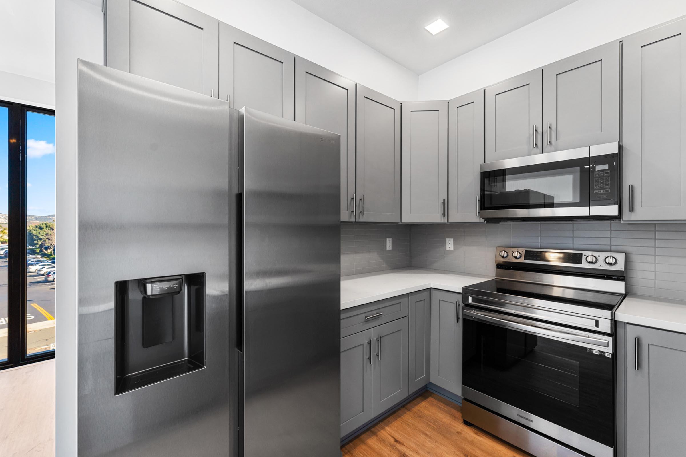 a large kitchen with stainless steel appliances