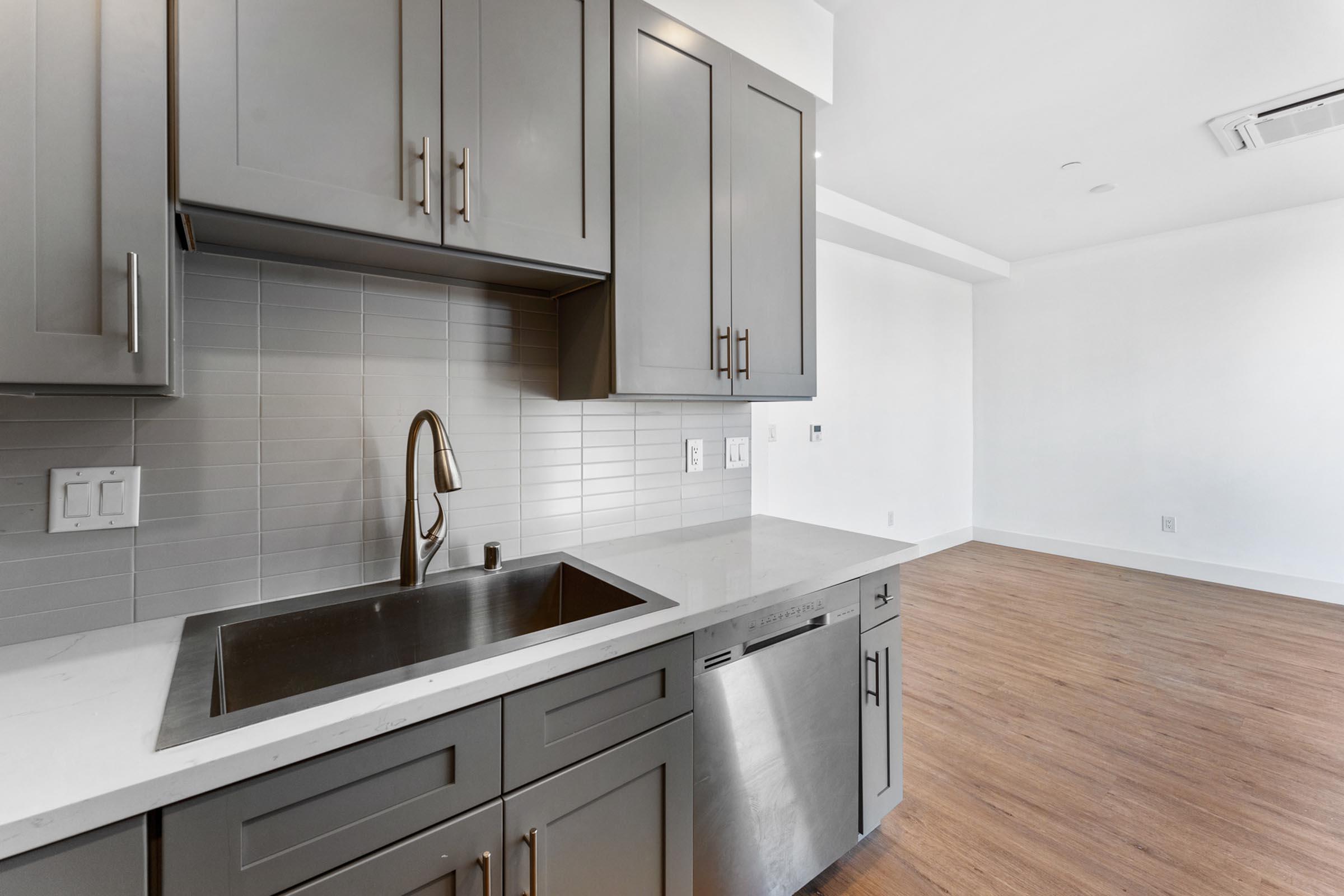 a kitchen with a stove and a sink