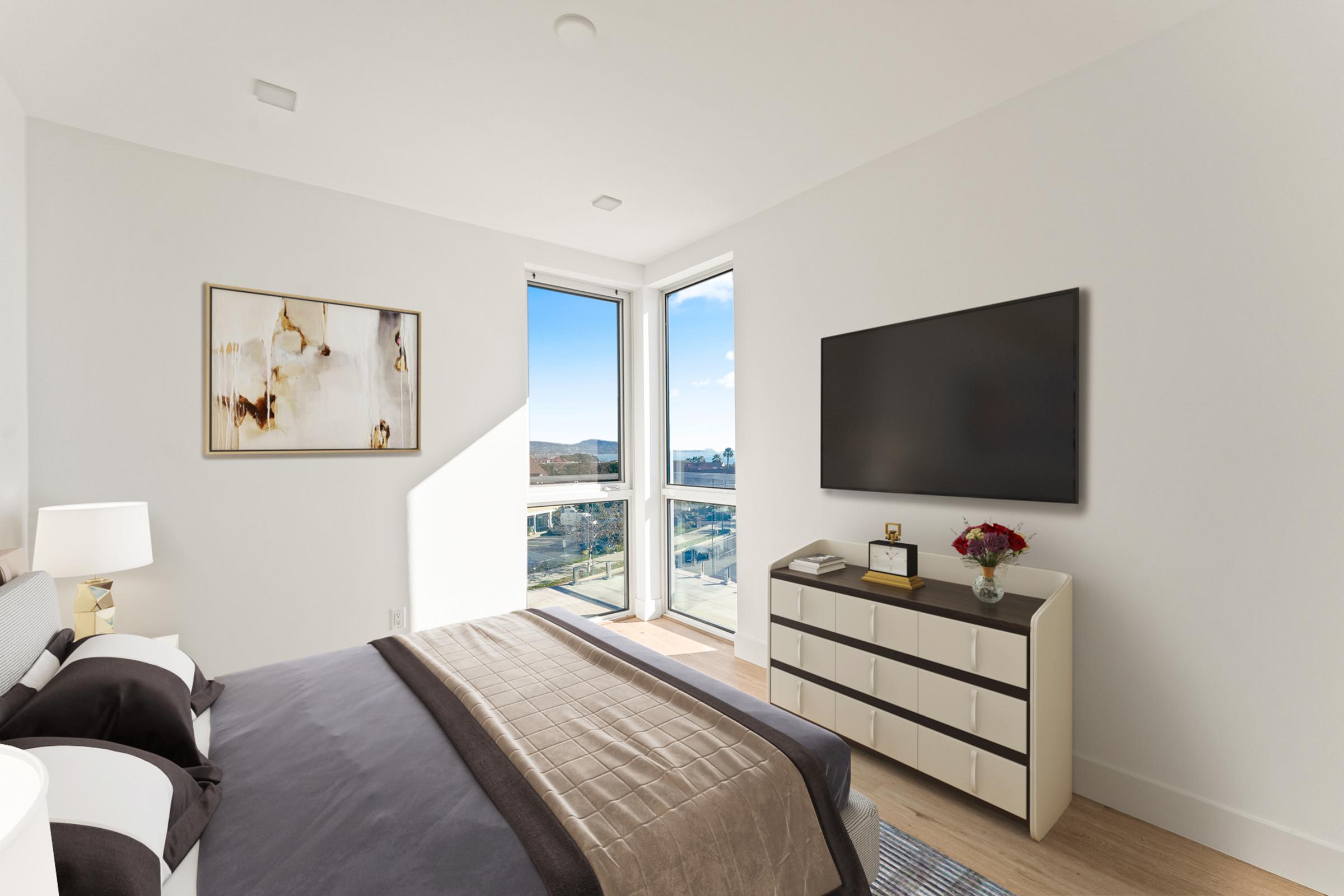 a bedroom with a view of a living room