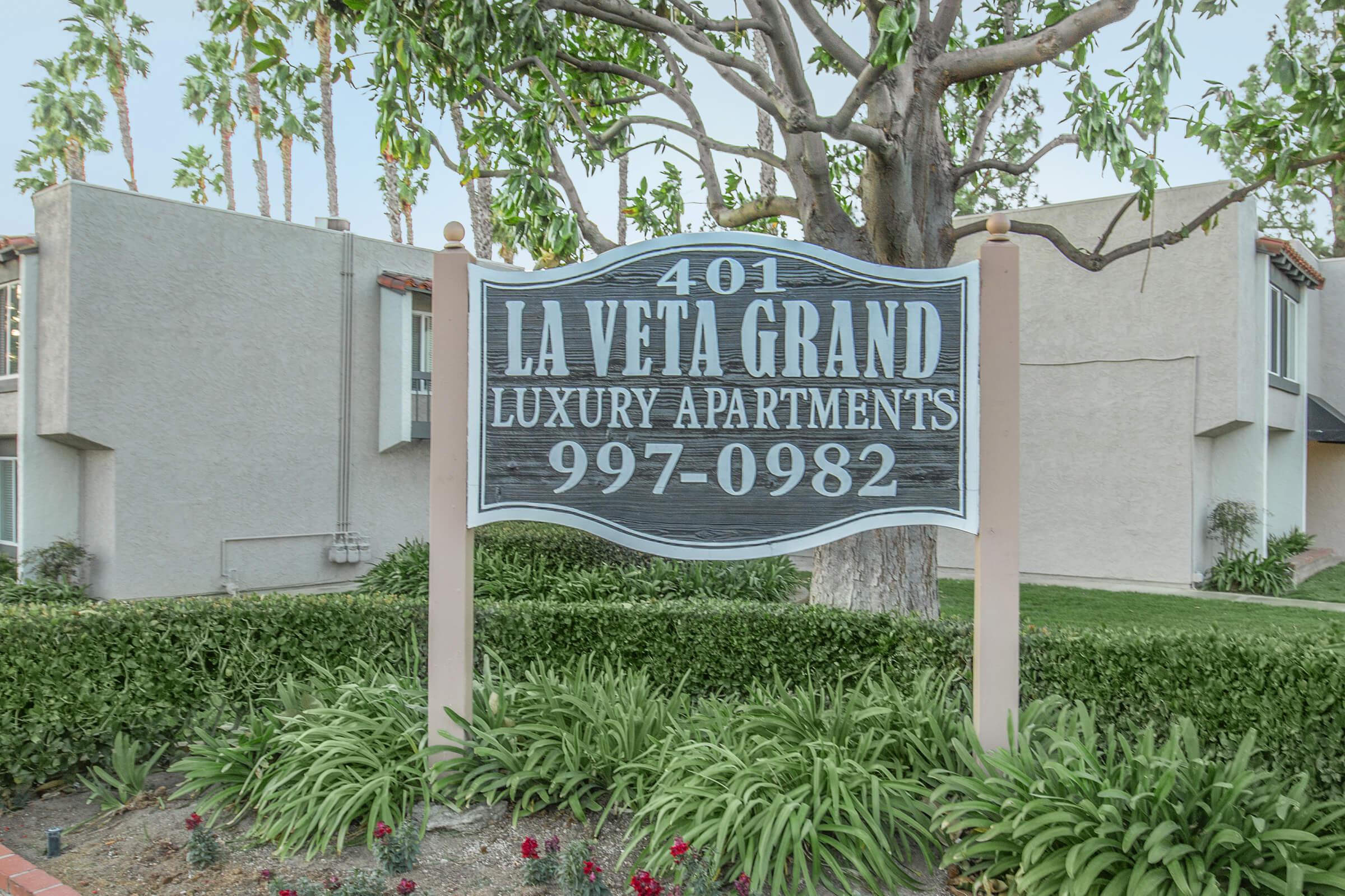 a sign in front of a house