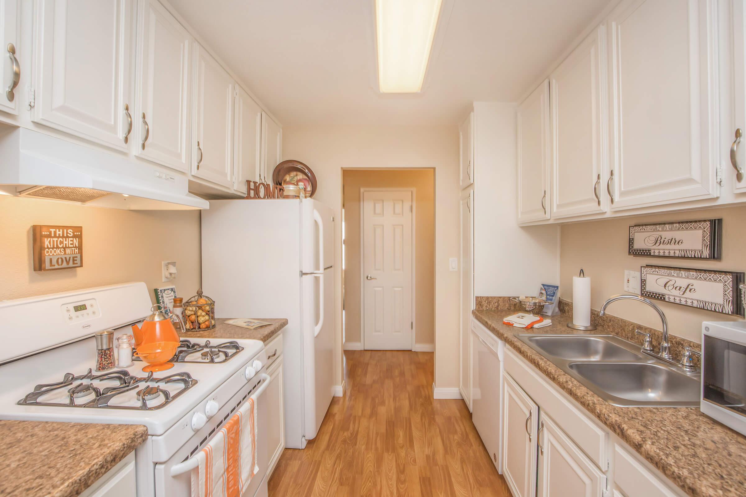 a kitchen with a stove and a sink