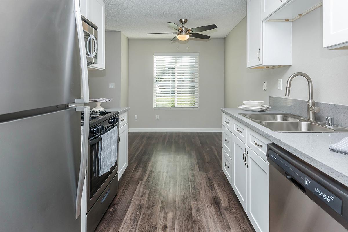 a kitchen with a sink and a window