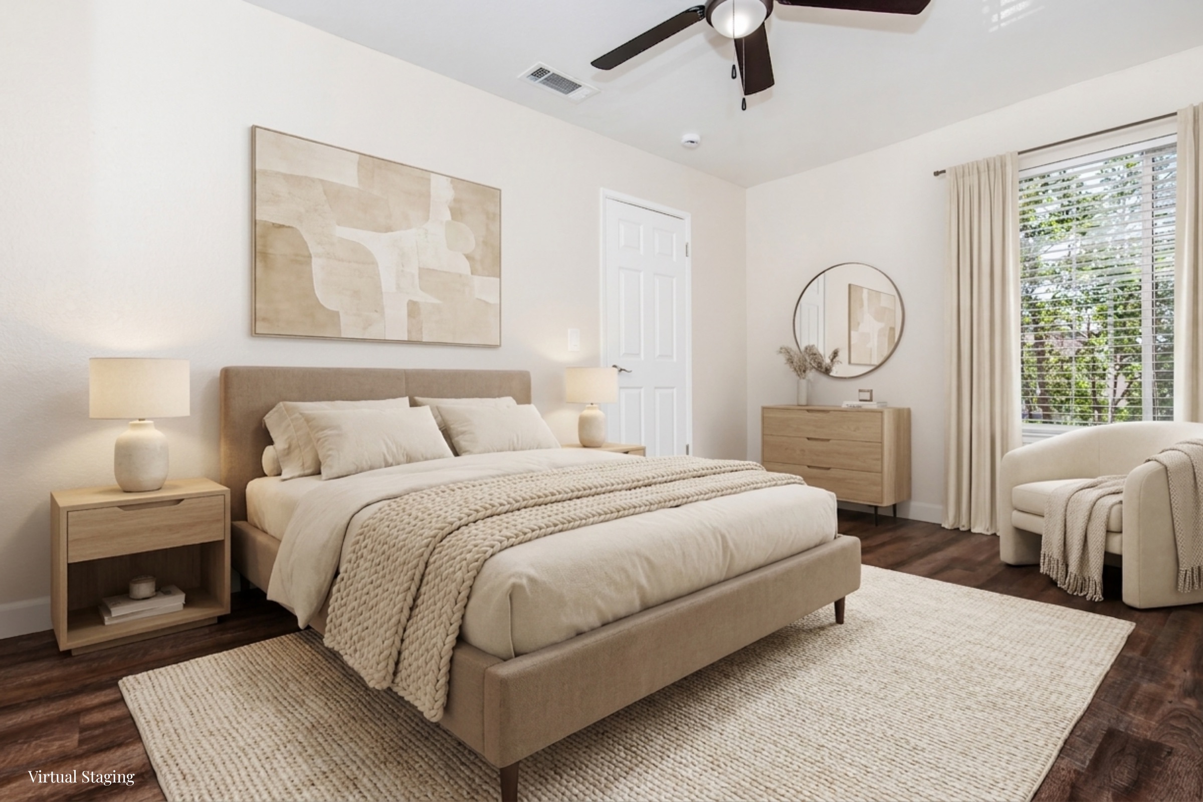 A cozy, elegantly designed bedroom featuring a queen-sized bed with soft beige bedding, wooden nightstands, and a matching dresser. The room has a large window with sheer curtains, allowing natural light to brighten the space. A round mirror and a textured area rug add warmth, complemented by tasteful wall art.