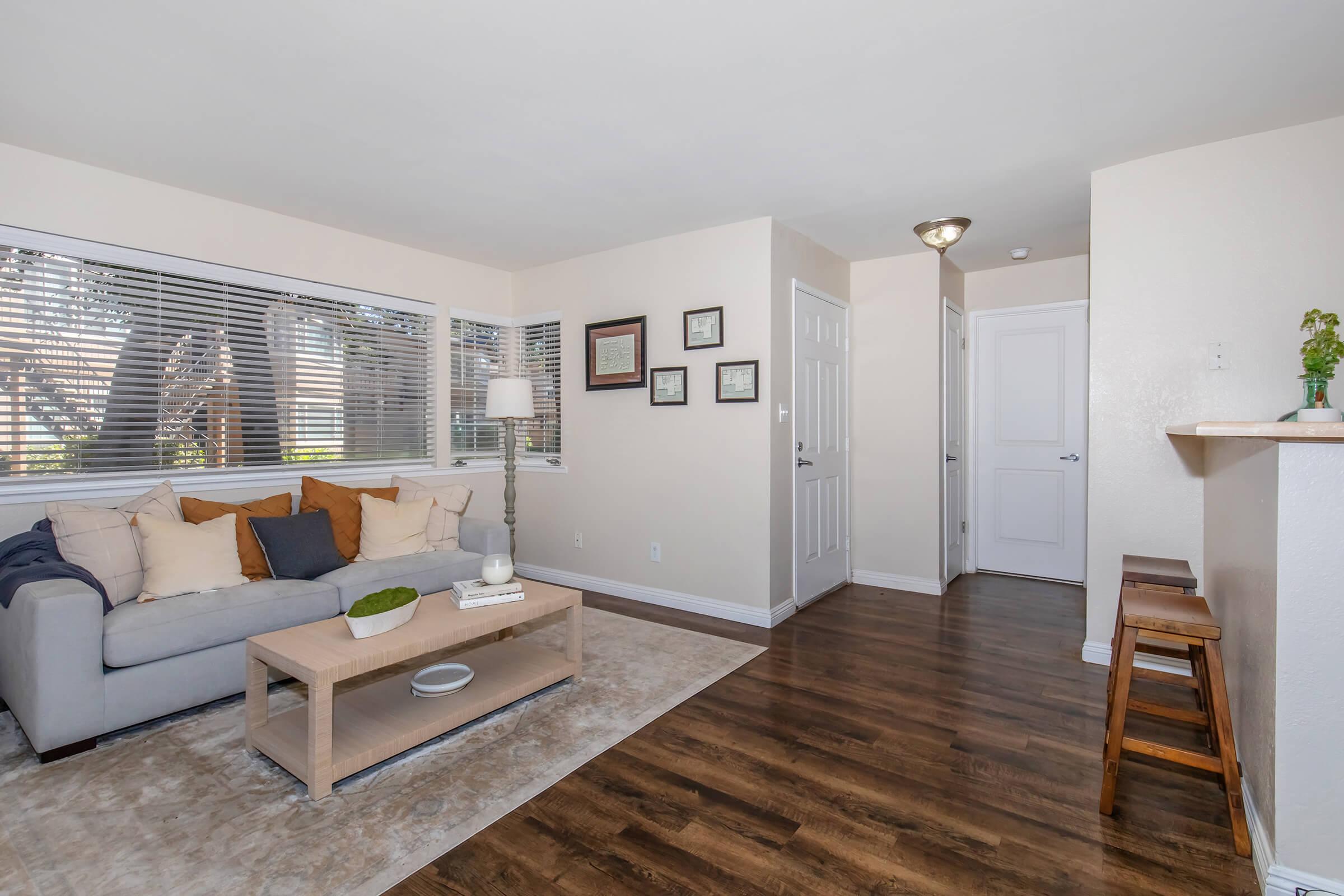 a living room with a wood floor