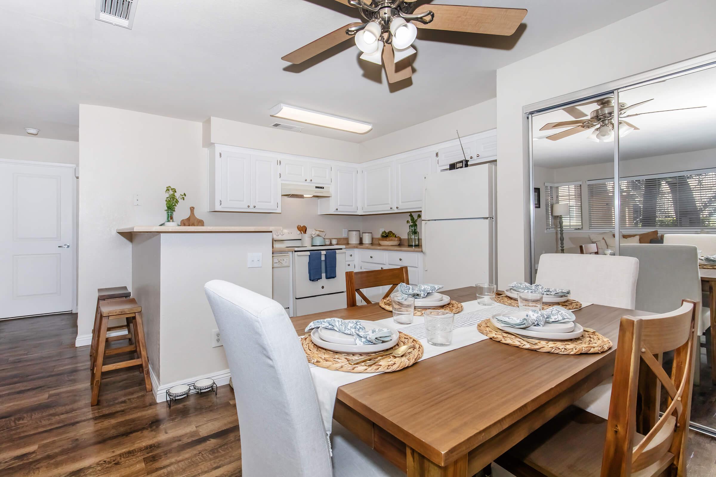 a kitchen with a dining room table